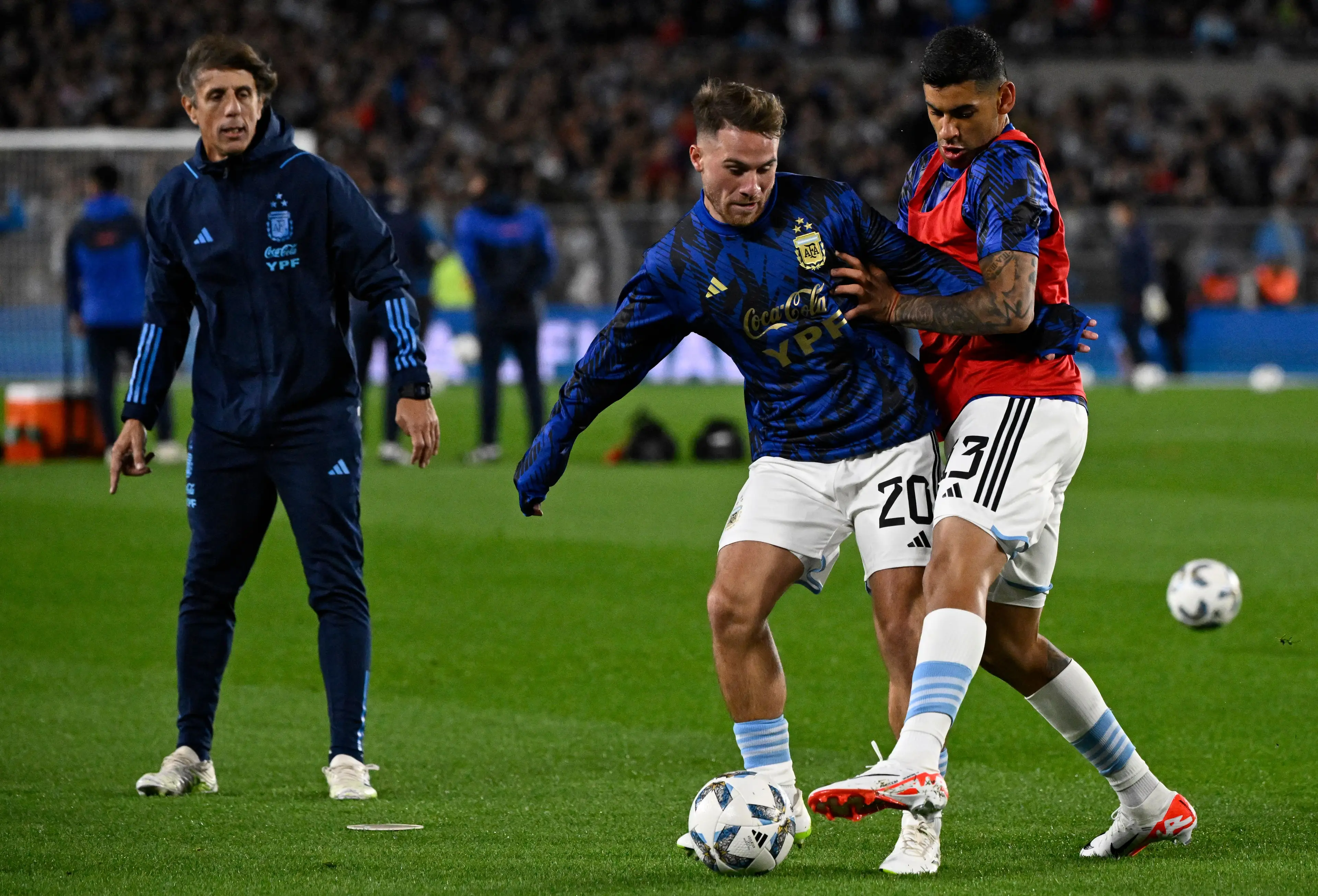 Alexis Mac Allister and Cristian Romero. (