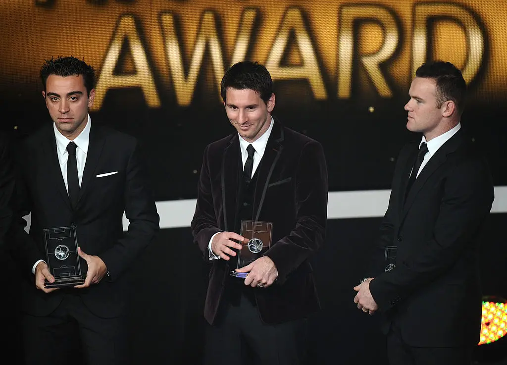 Xavi, Lionel Messi and Wayne Rooney (Credit:Getty)