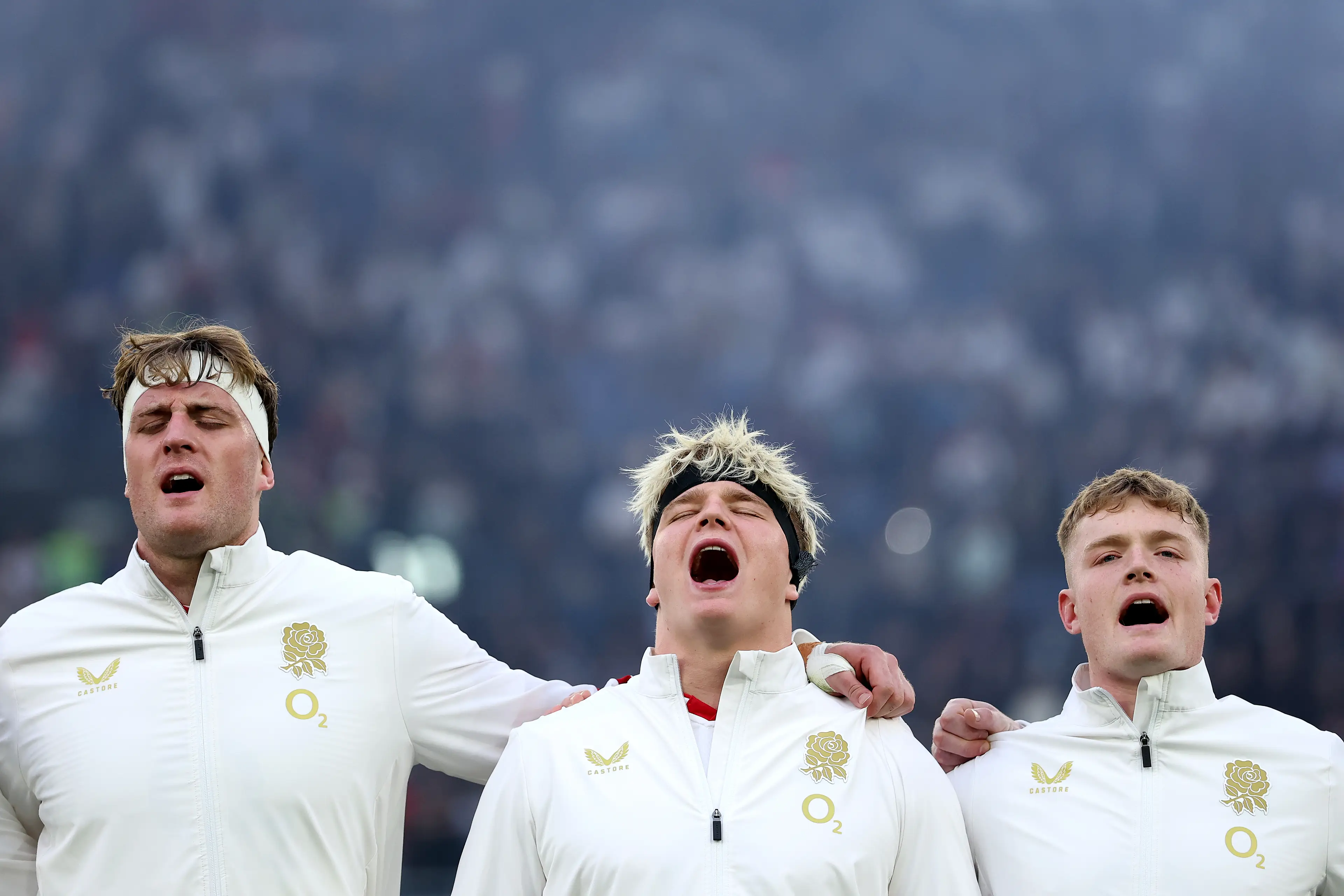  Alex Coles, Henry Pollock and Fin Smith of England line up for the national anthem prior to the Guinness Six Nations 2026 match between Italy and England (Getty Images)