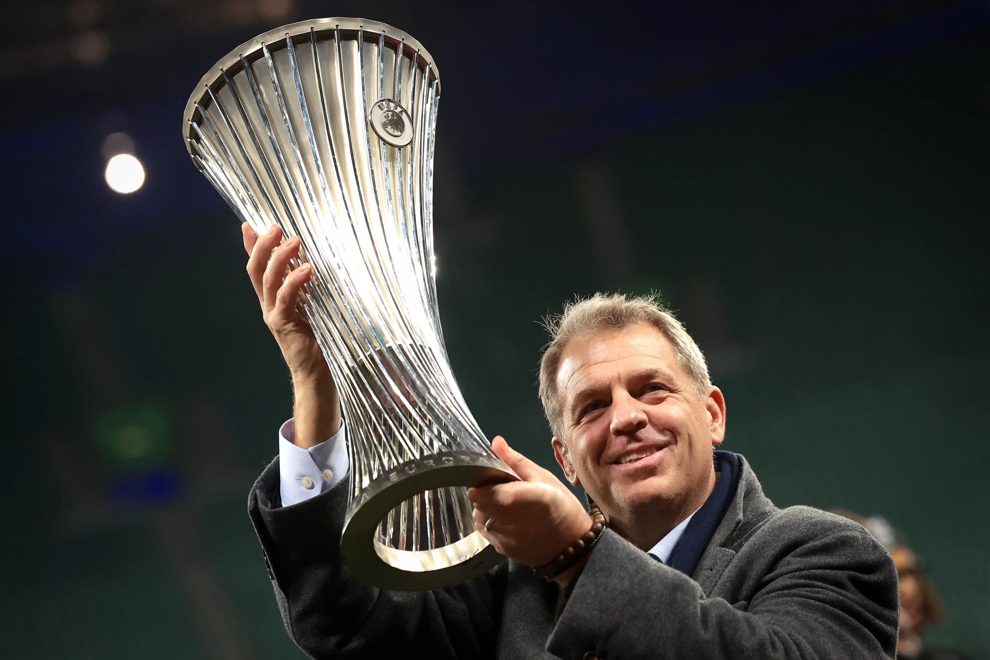Chelsea co-owner Todd Boehly holds aloft the Conference League trophy. Image: Getty