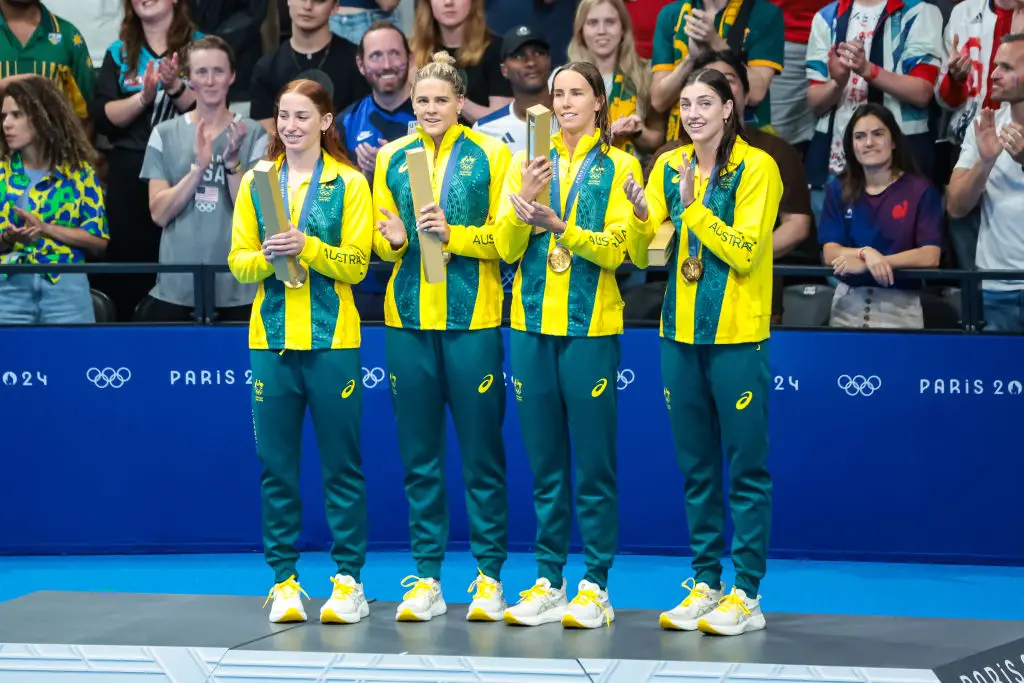 Australia's women's 4x100m freestyle relay team celebrate after winning a gold medal at the Paris 2024 Olympics -