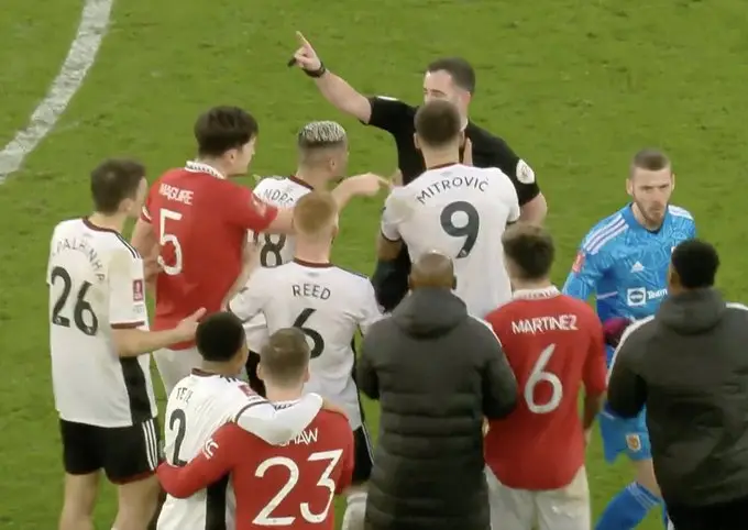 Luke Shaw and Tete hug it out. Image: ITV/FA Cup