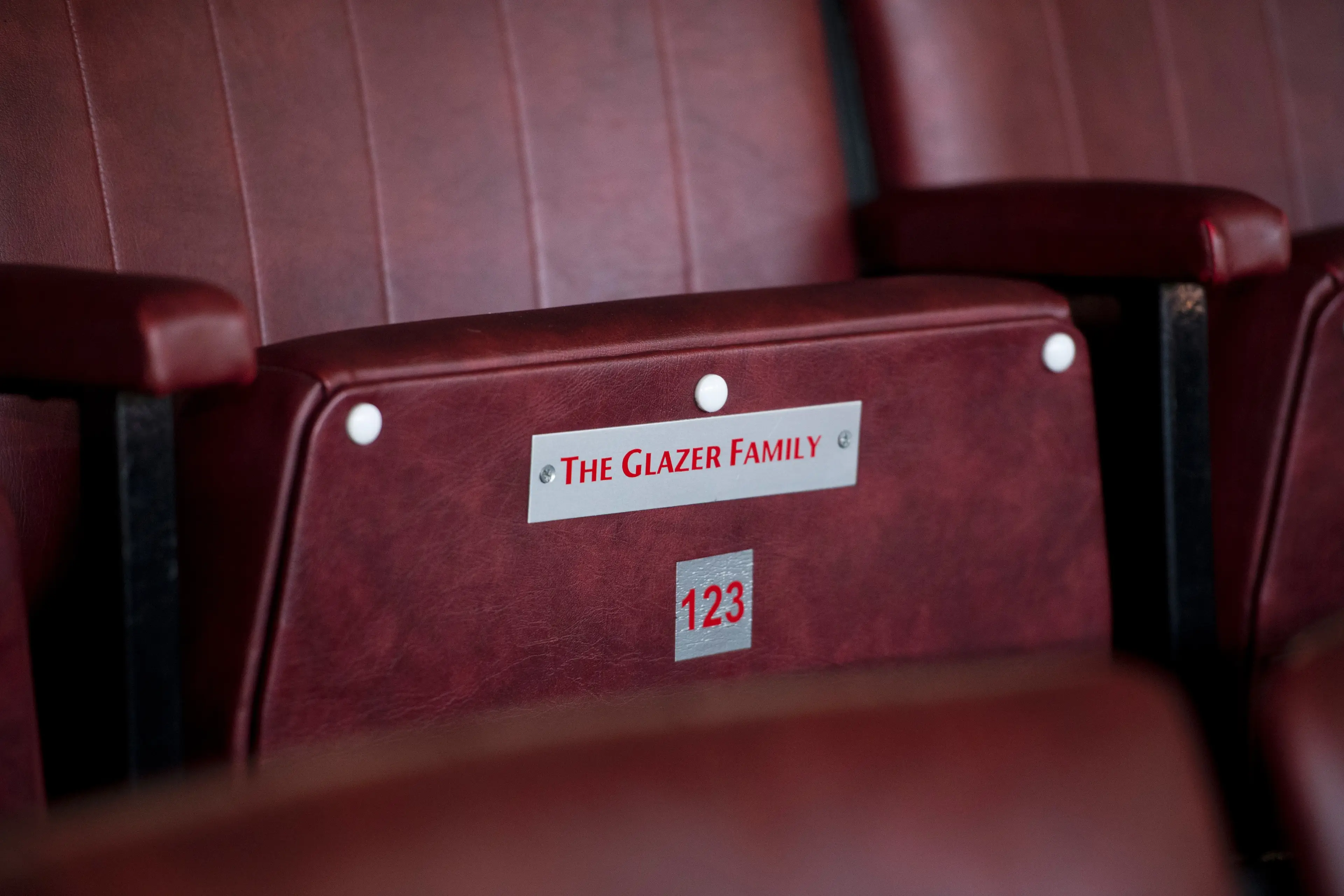A seat reserved for members of the Glazer family is pictured in the director's box at Old Trafford. Image credit: Getty
