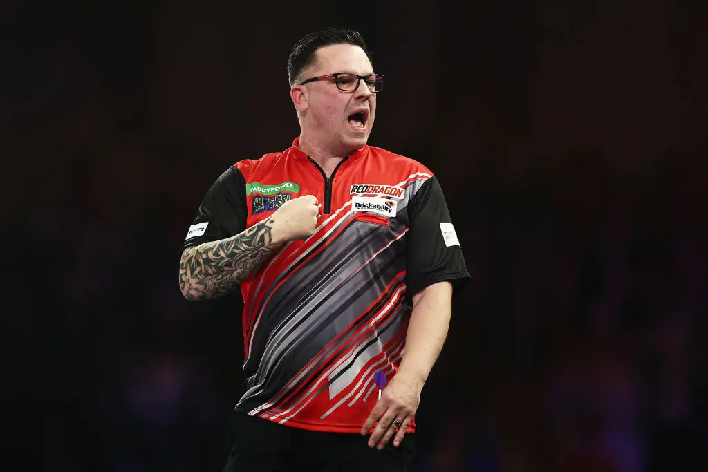Robert Owen celebrates during his World Darts Championship third round match against Ricky Evans (Image: Getty)