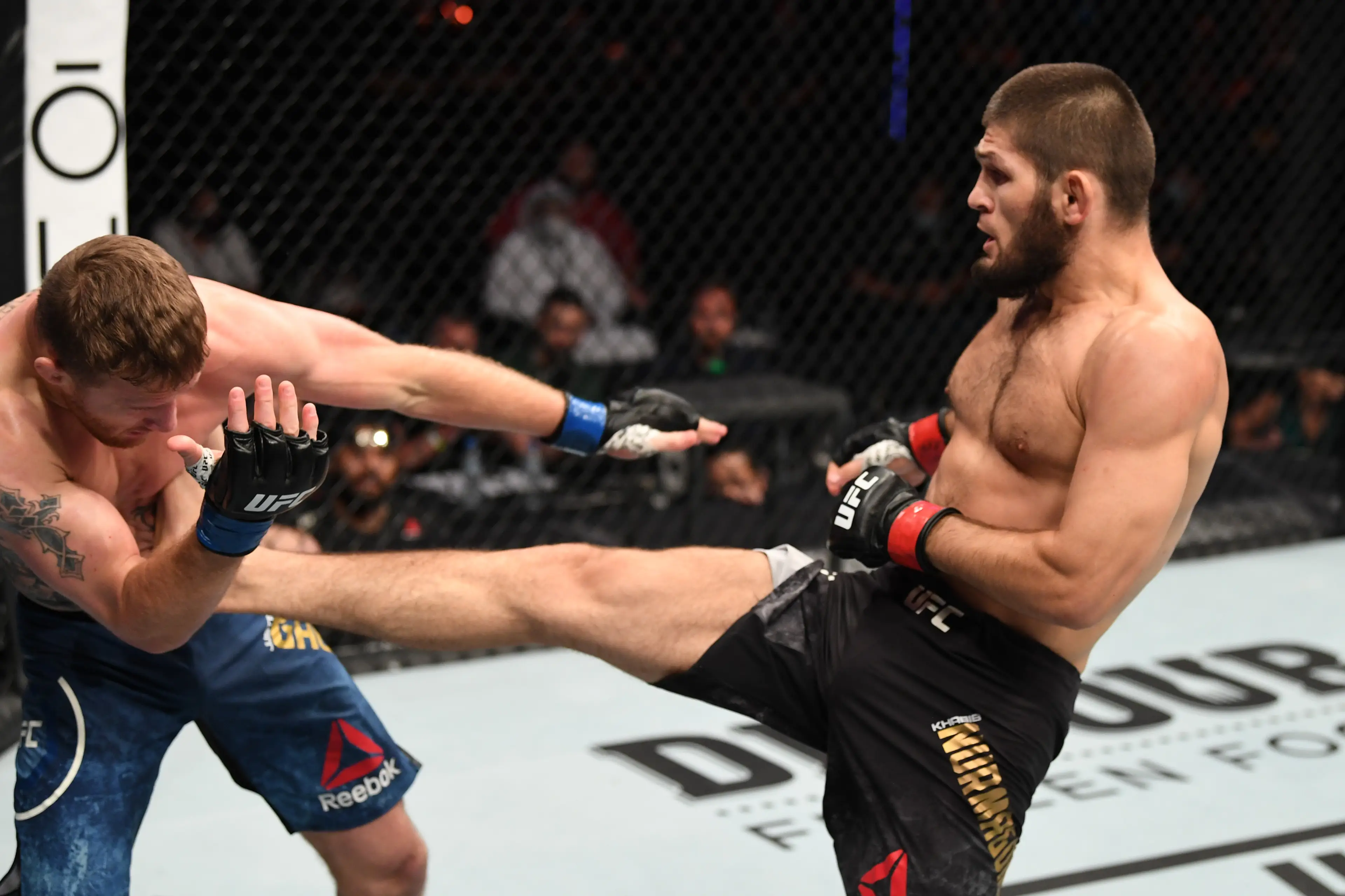 Khabib Nurmagomedov of Russia kicks Justin Gaethje in their lightweight title bout during the UFC 254 event on October 25, 2020 on UFC Fight Island, Abu Dhabi, United Arab Emirates. Getty Images