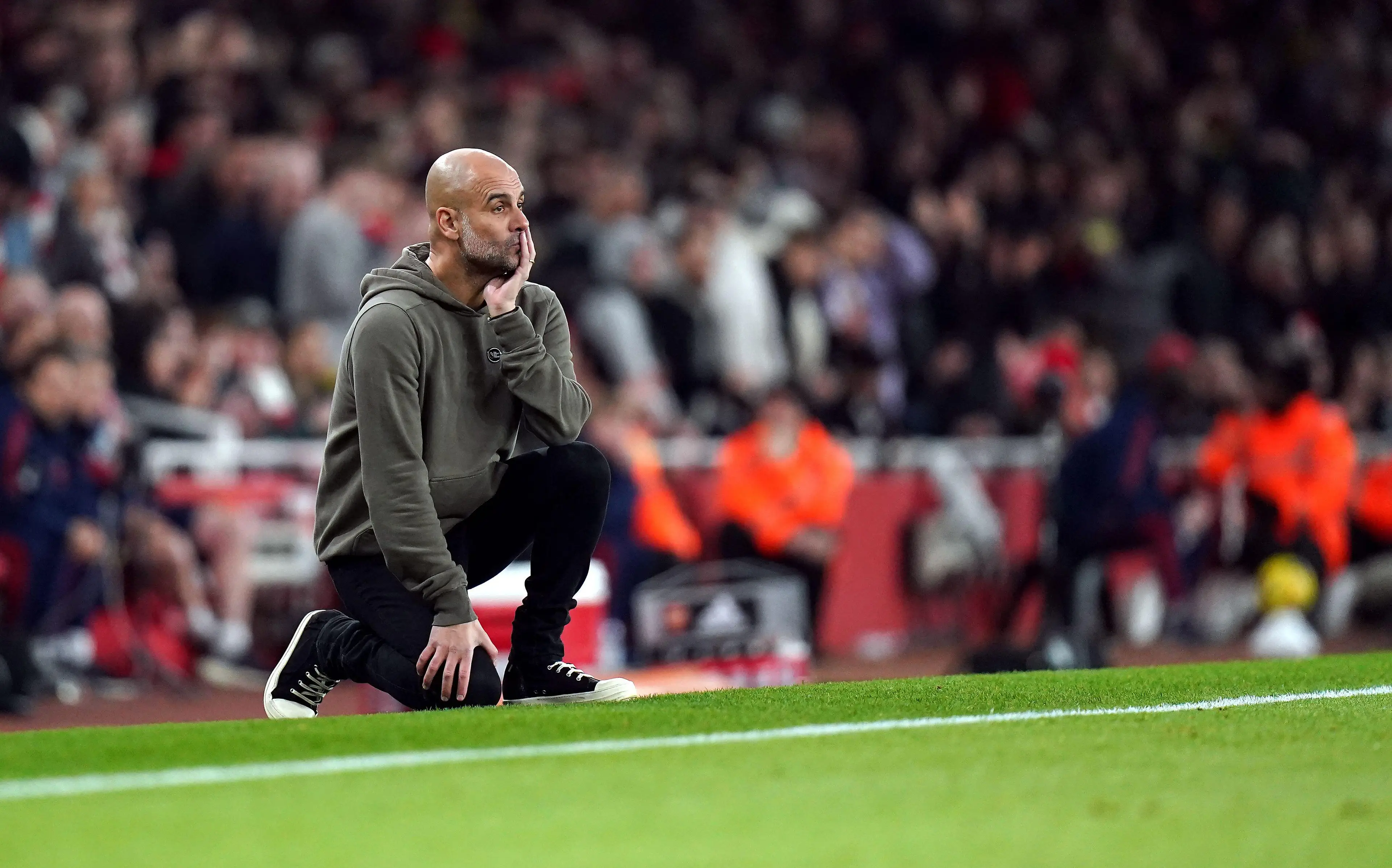 Pep Guardiola on the touchline at the Emirates. Image: Alamy