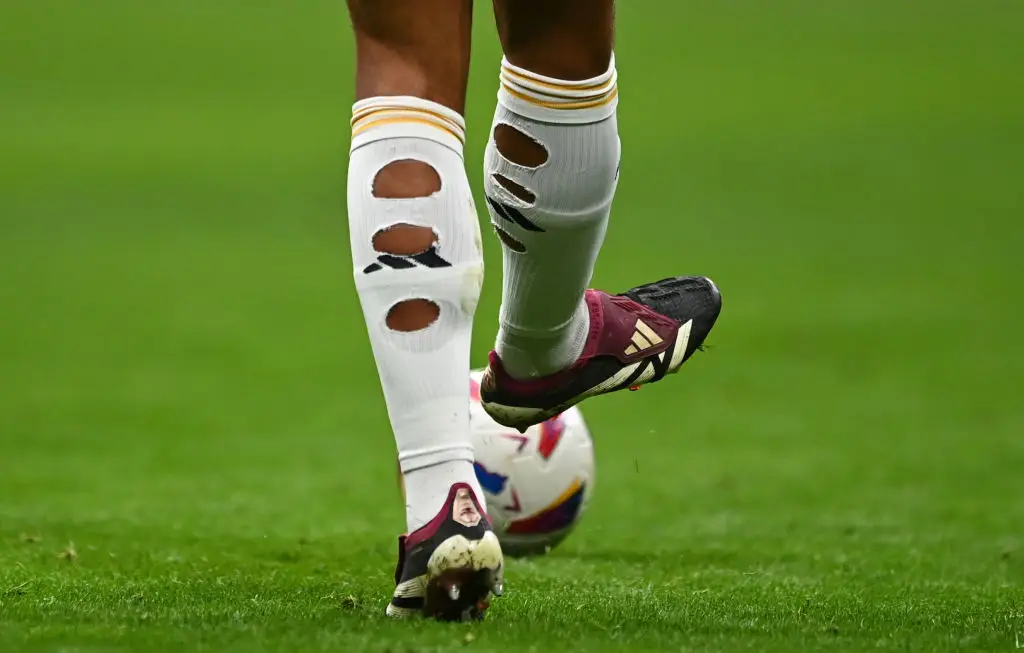 Bellingham regularly cuts holes in his socks for medical reasons (Image: Getty)