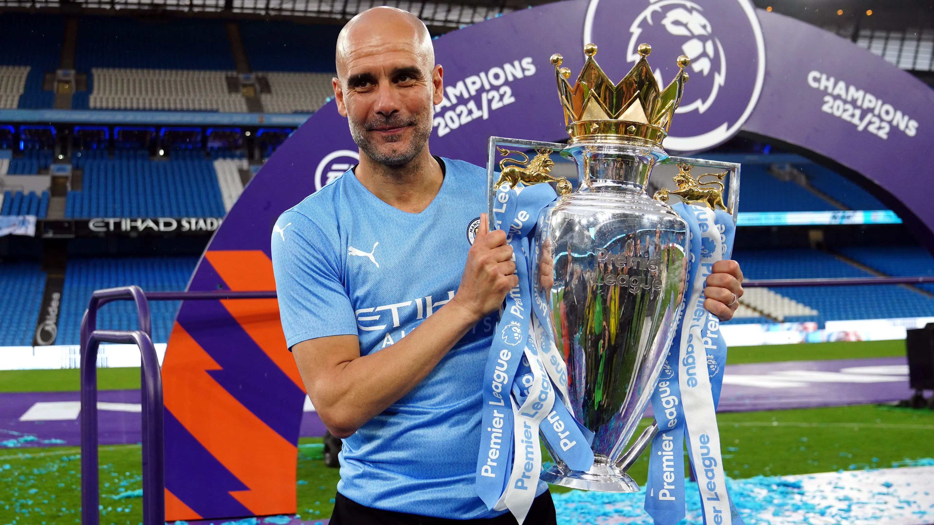 Pep Guardiola with the Premier League trophy