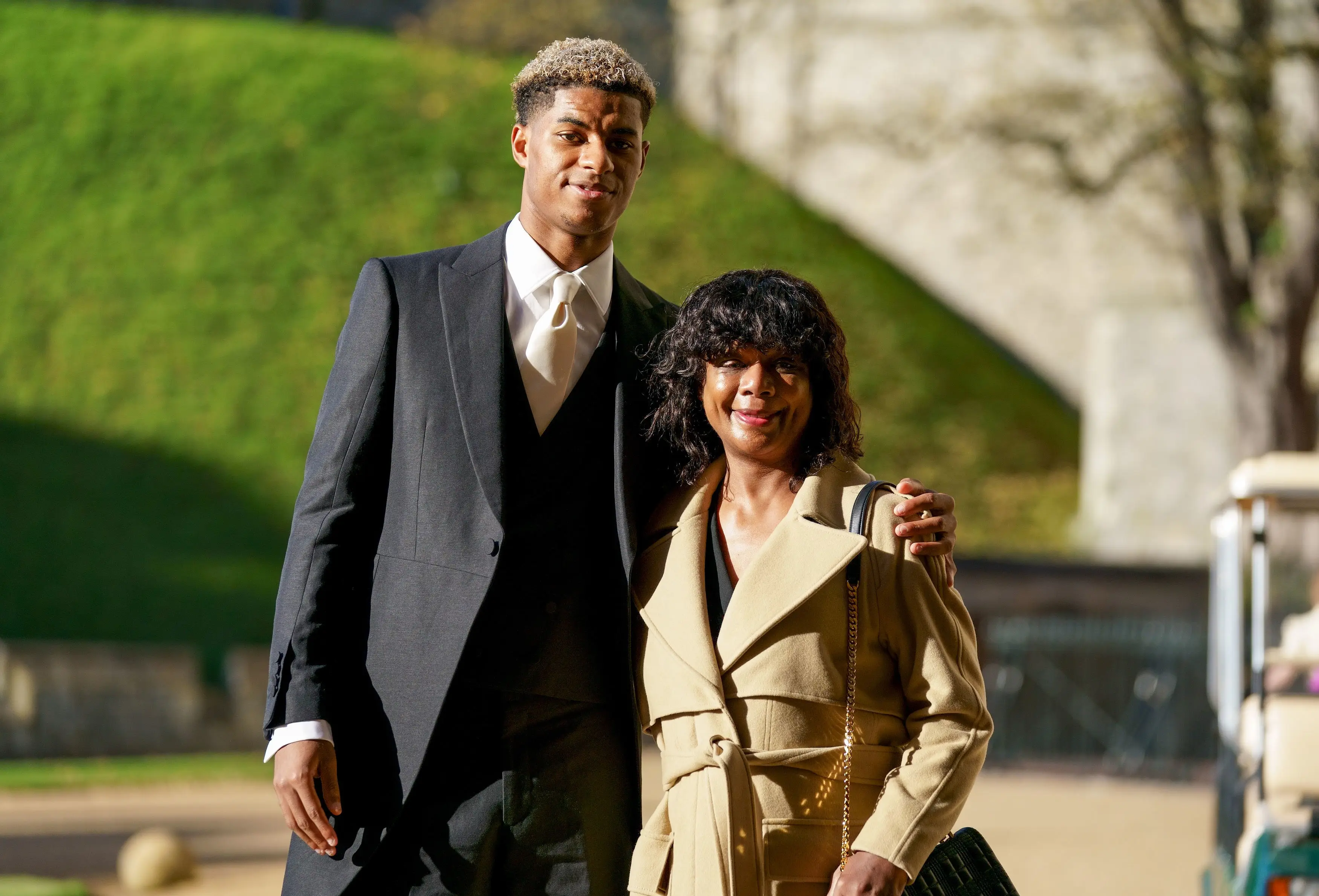 Rashford alongside his mum. (Image: Getty)
