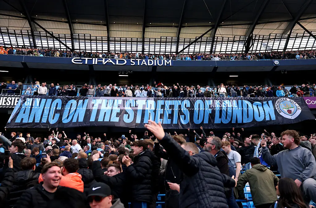 Man City fans unveiled a banner at full time (Credit:Getty)