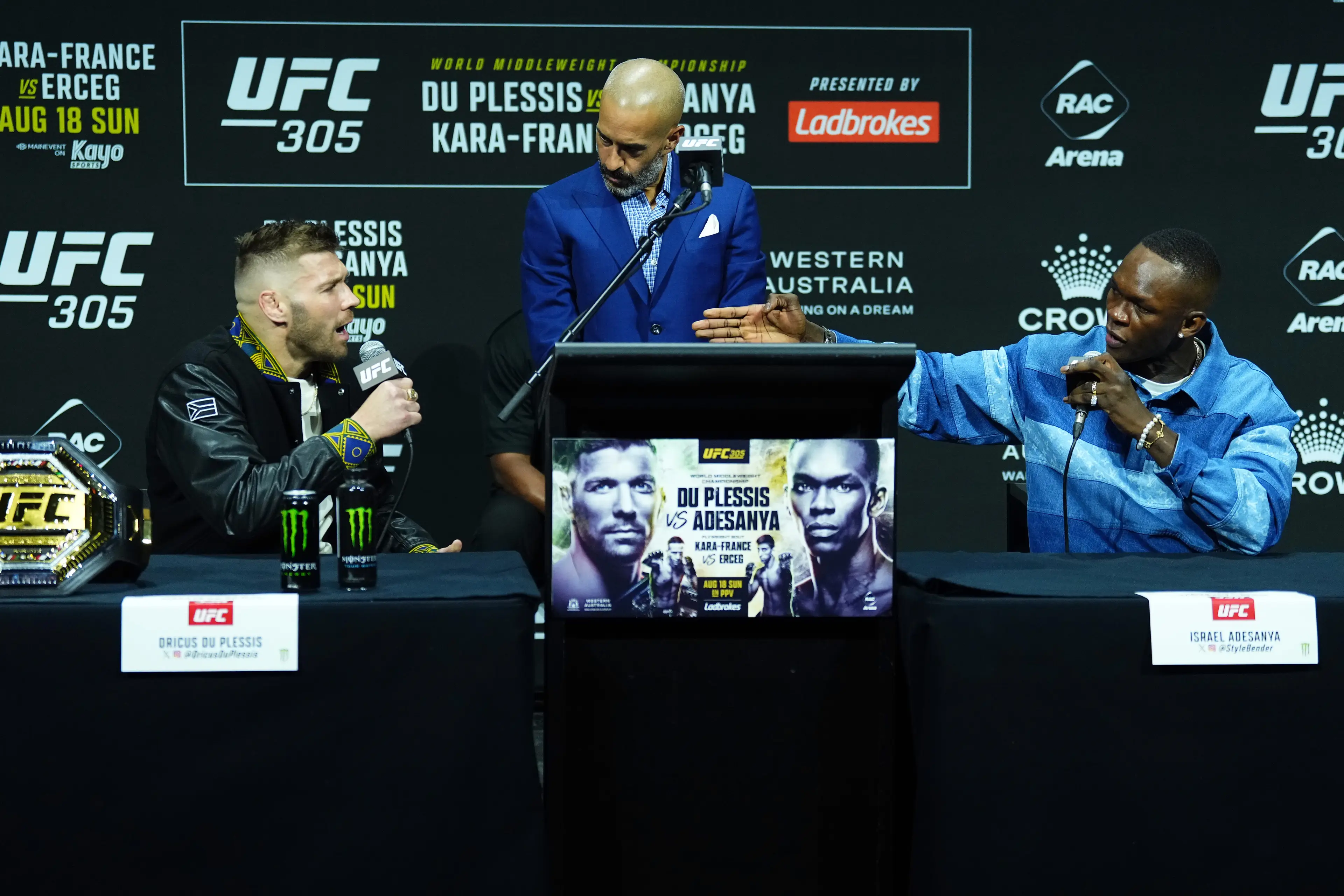 Dricus du Plessis and Israel Adesanya exchange words at the UFC 305 pre-fight presser. Image: Getty