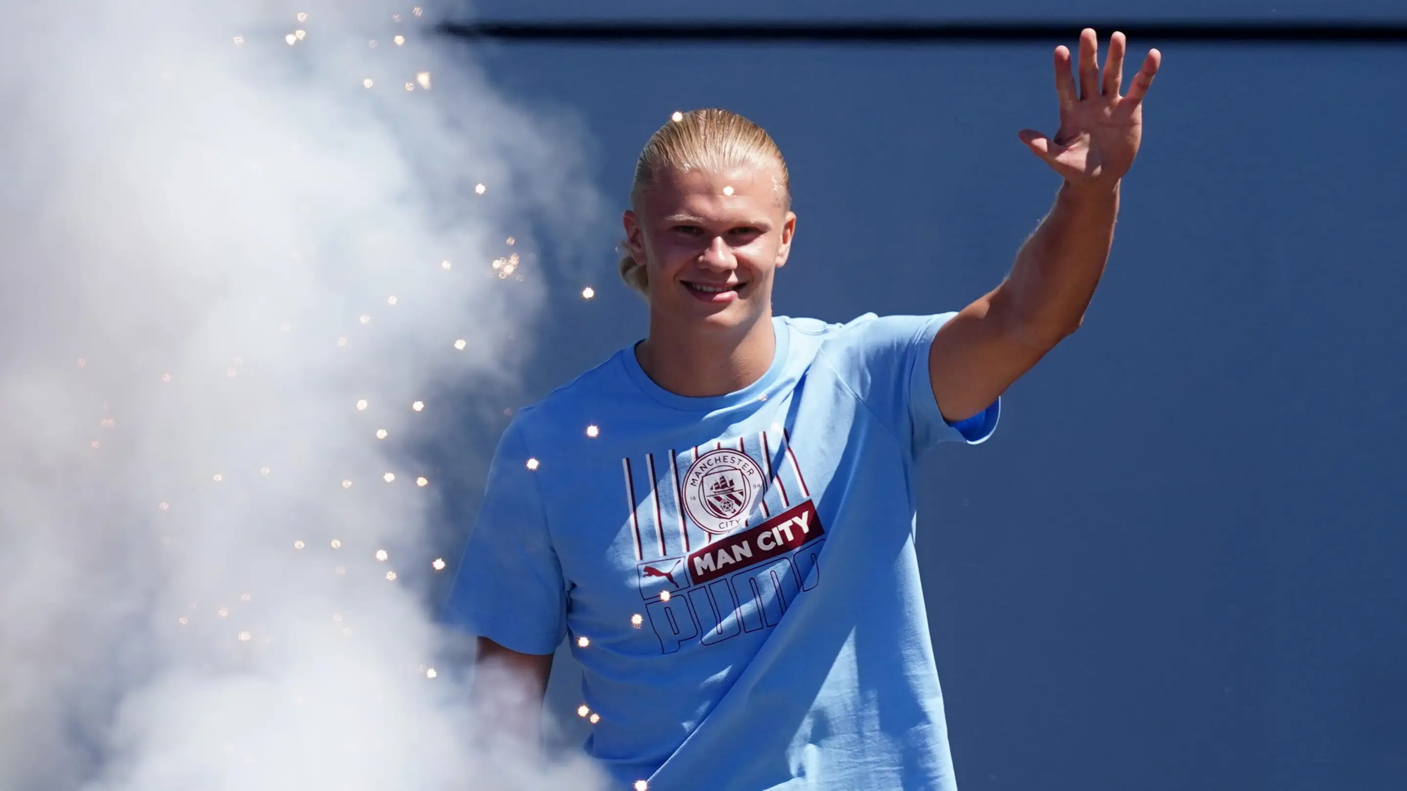 Erling Haaland waves to Manchester City supporters.