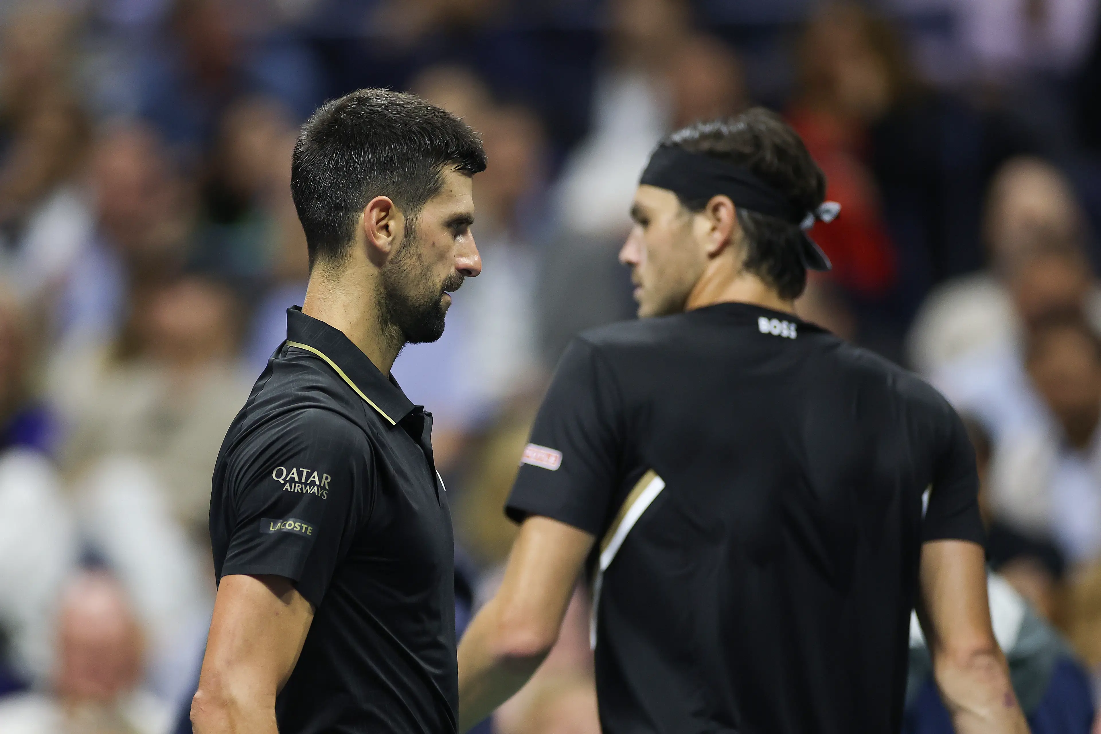Novak Djokovic and Taylor Fritz. Image: Sarah Stier / Staff via Getty