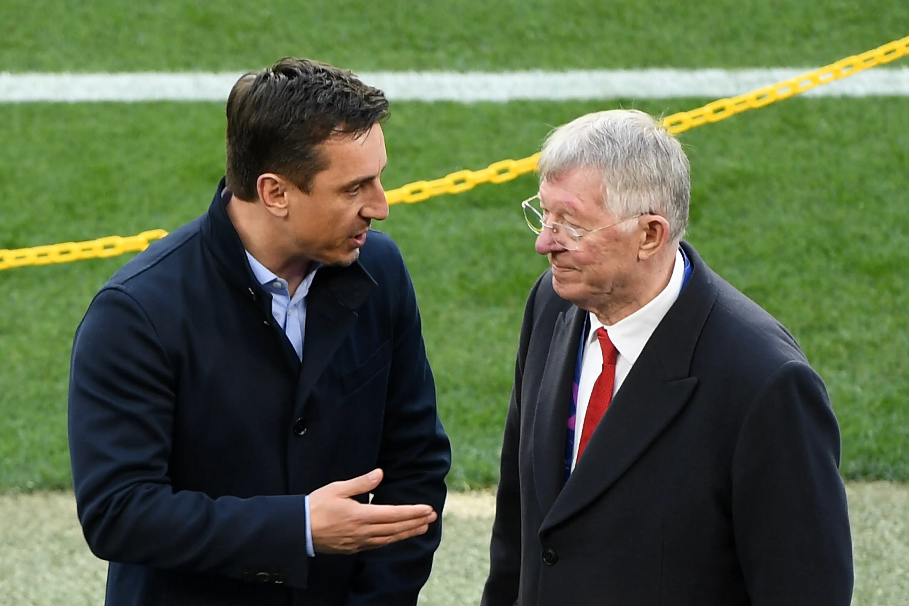Gary Neville speaks with Sir Alex Ferguson. Image: Getty