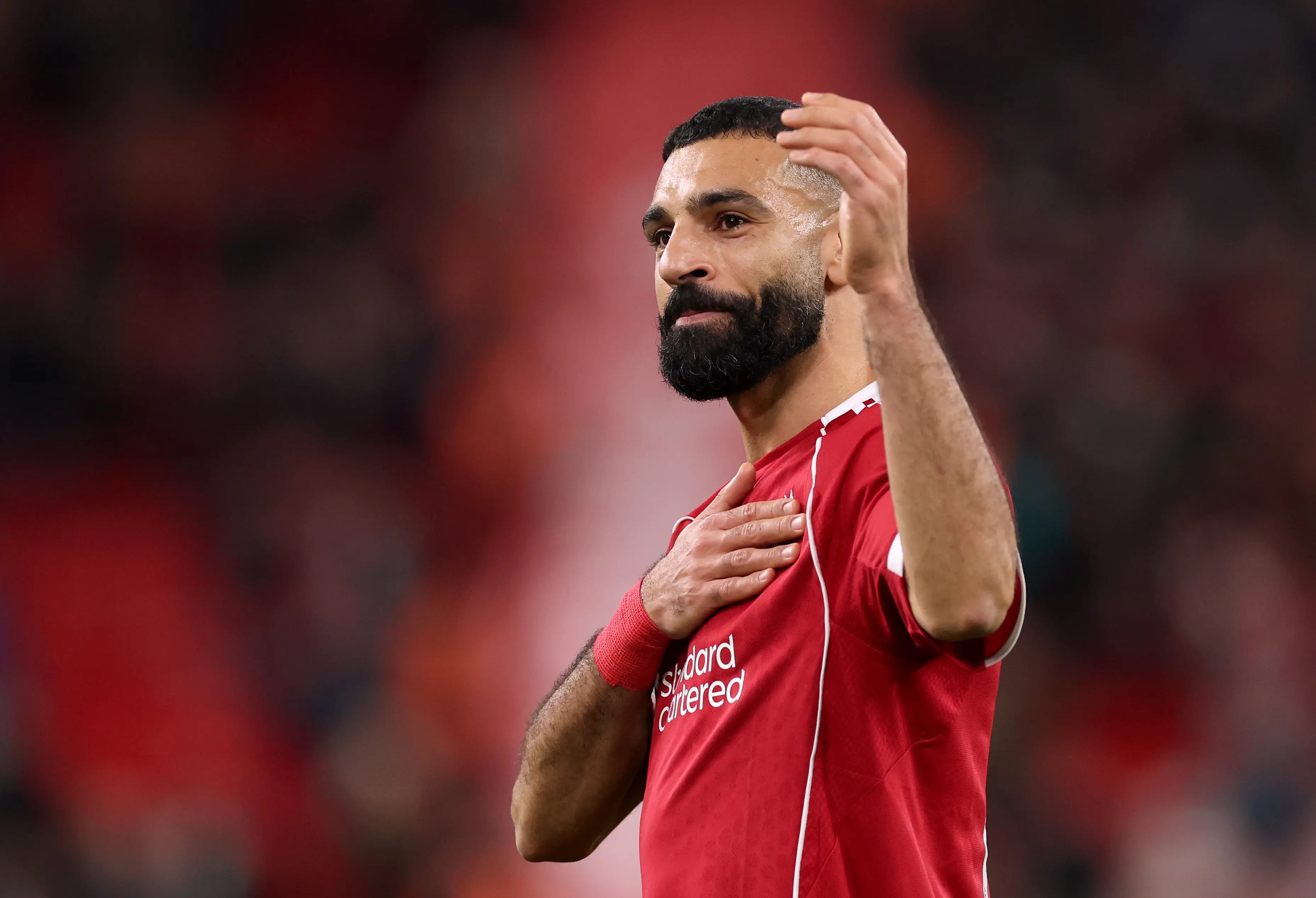 Salah acknowledges the Liverpool fans following Saturday's win over Brighton. Image credit: Getty