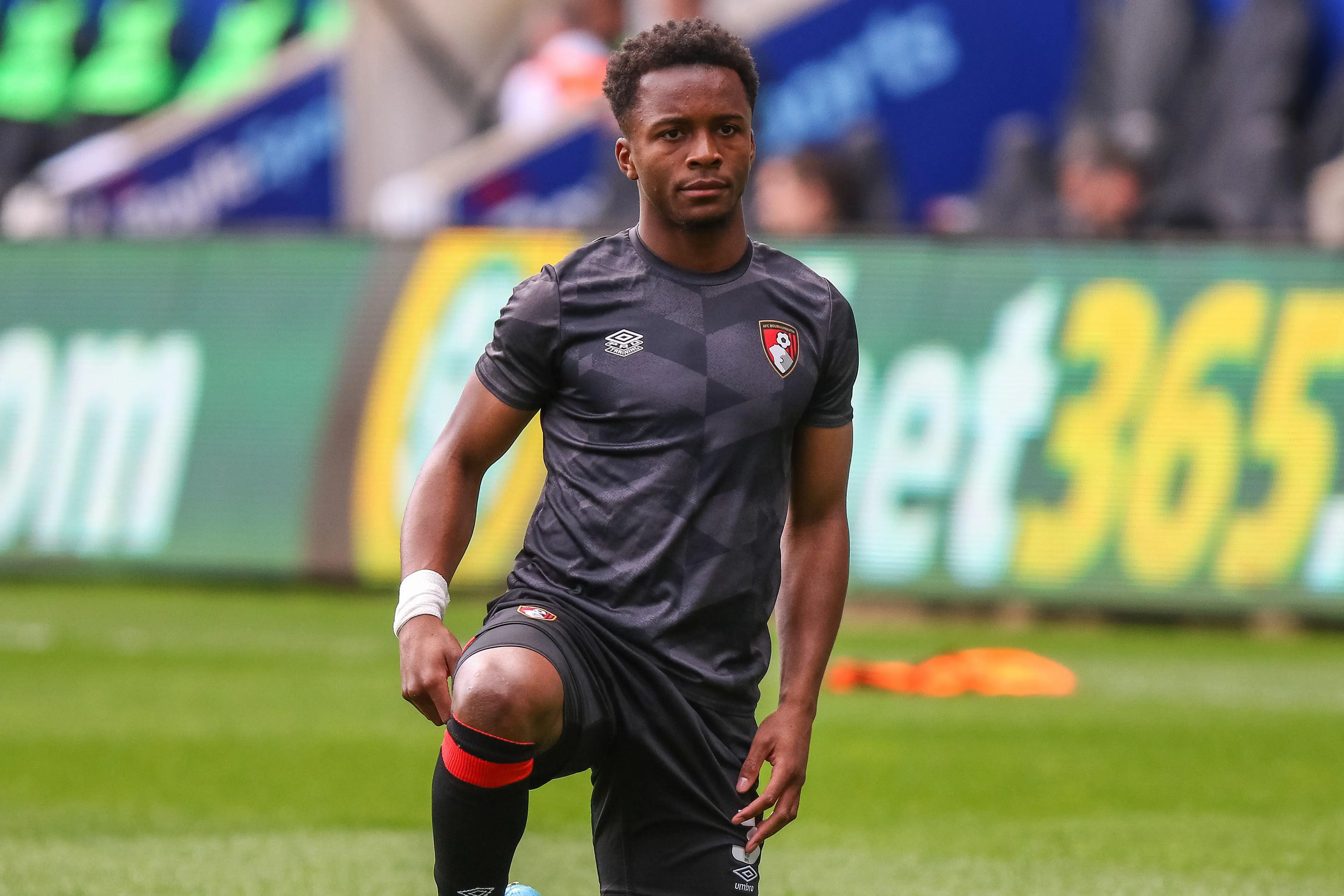 Ethan Laird warming up for Bournemouth. (Alamy)