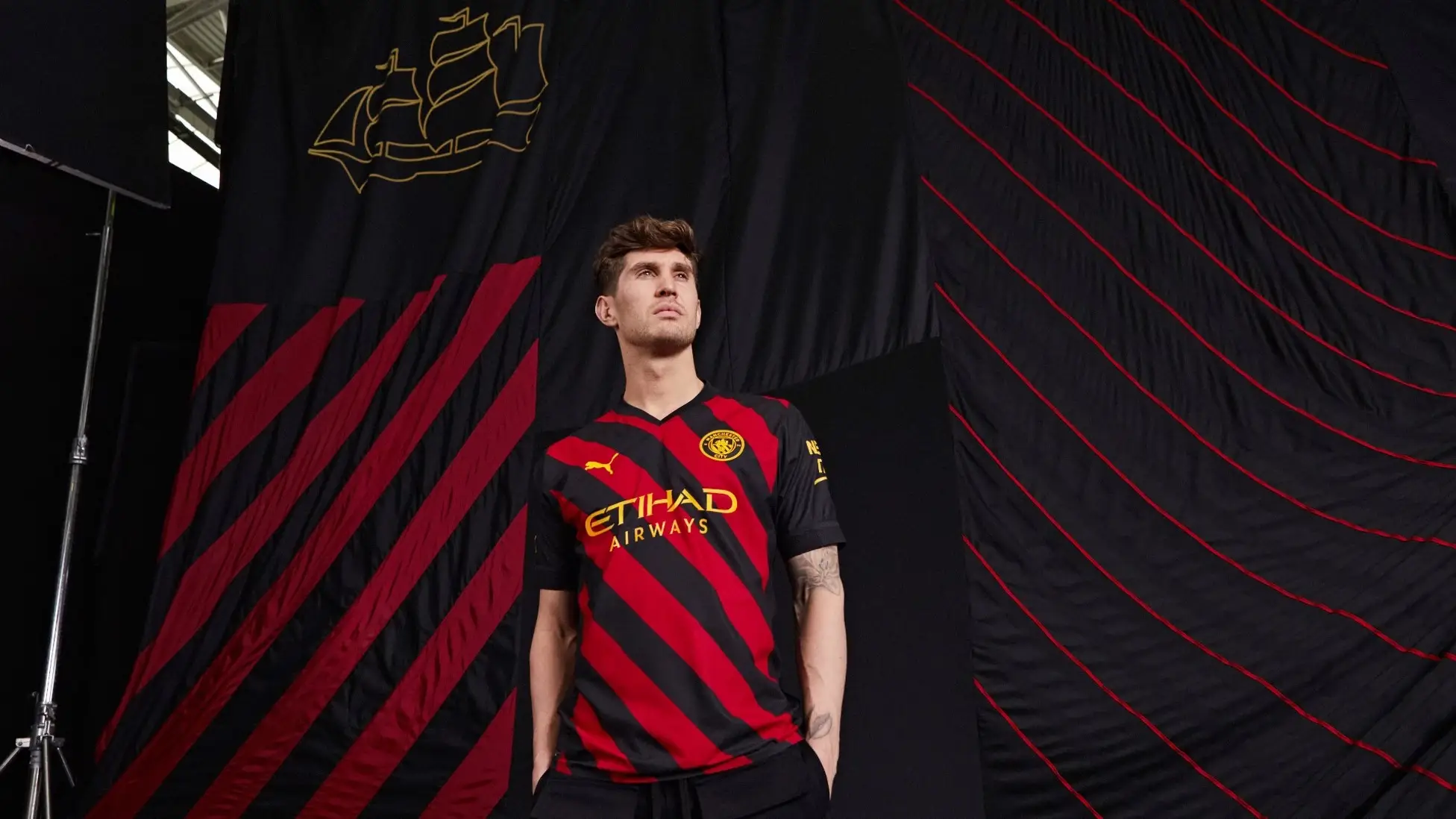 John Stones poses in Man City's new away kit (Manchester City / ManCity.com)