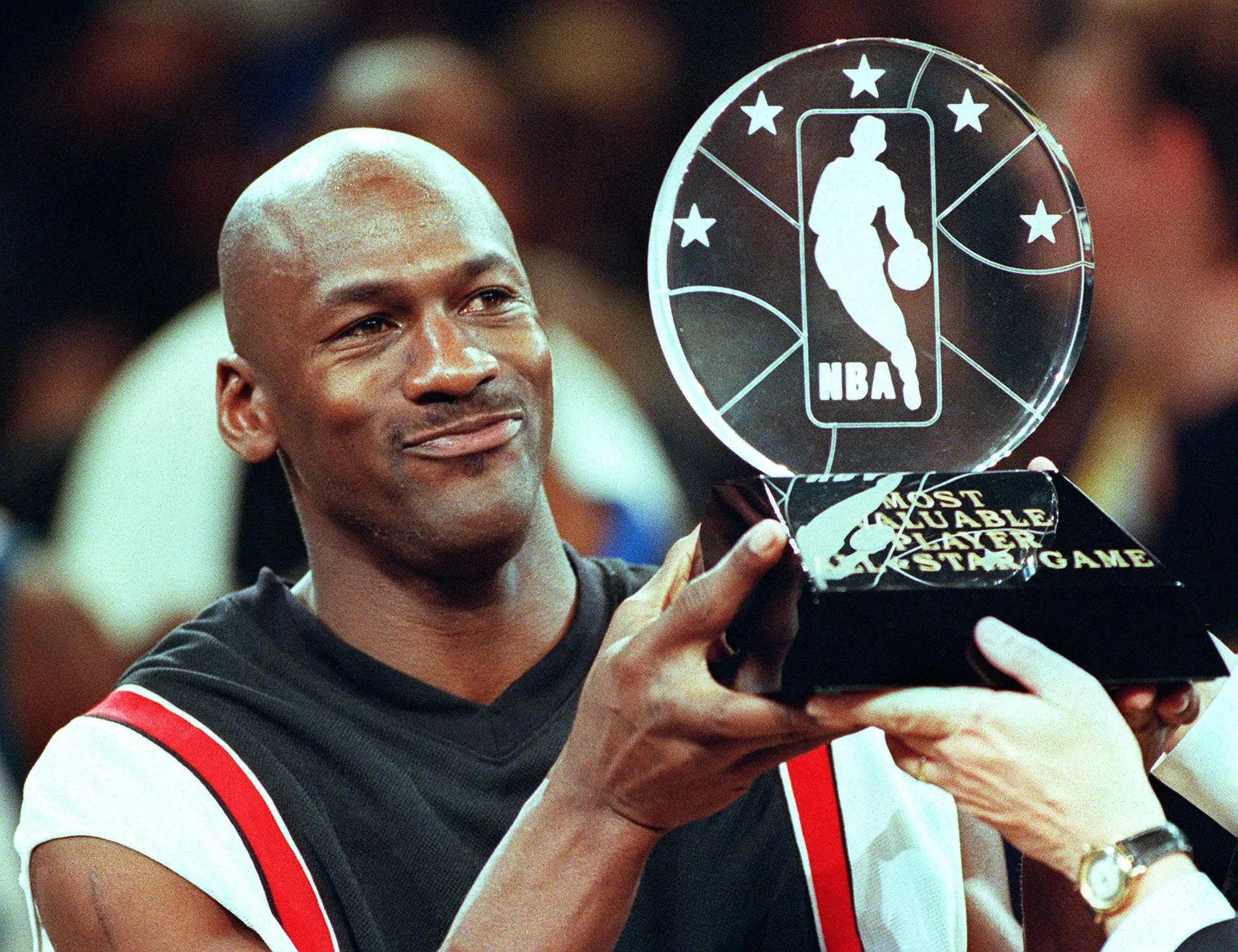 Michael Jordan holds the MVP trophy. Image: Getty