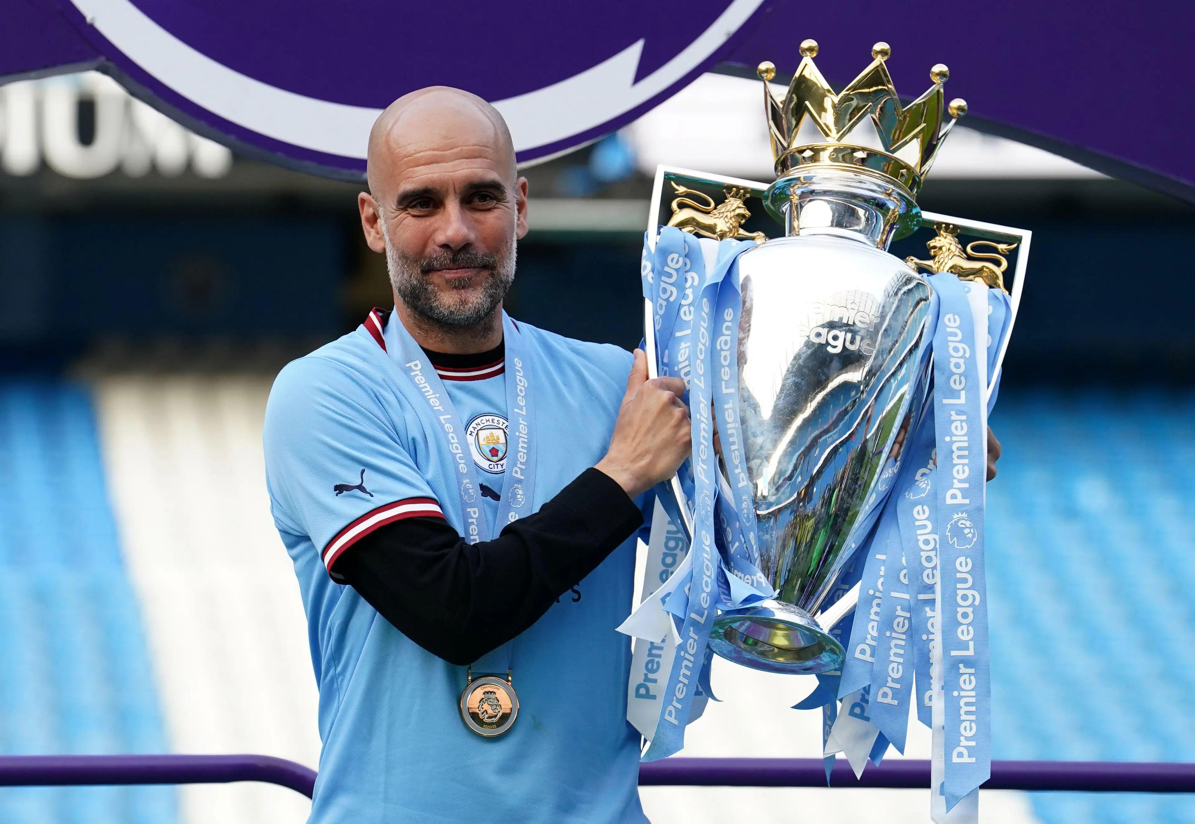 Pep Guardiola with the Premier League title. Image: Alamy 