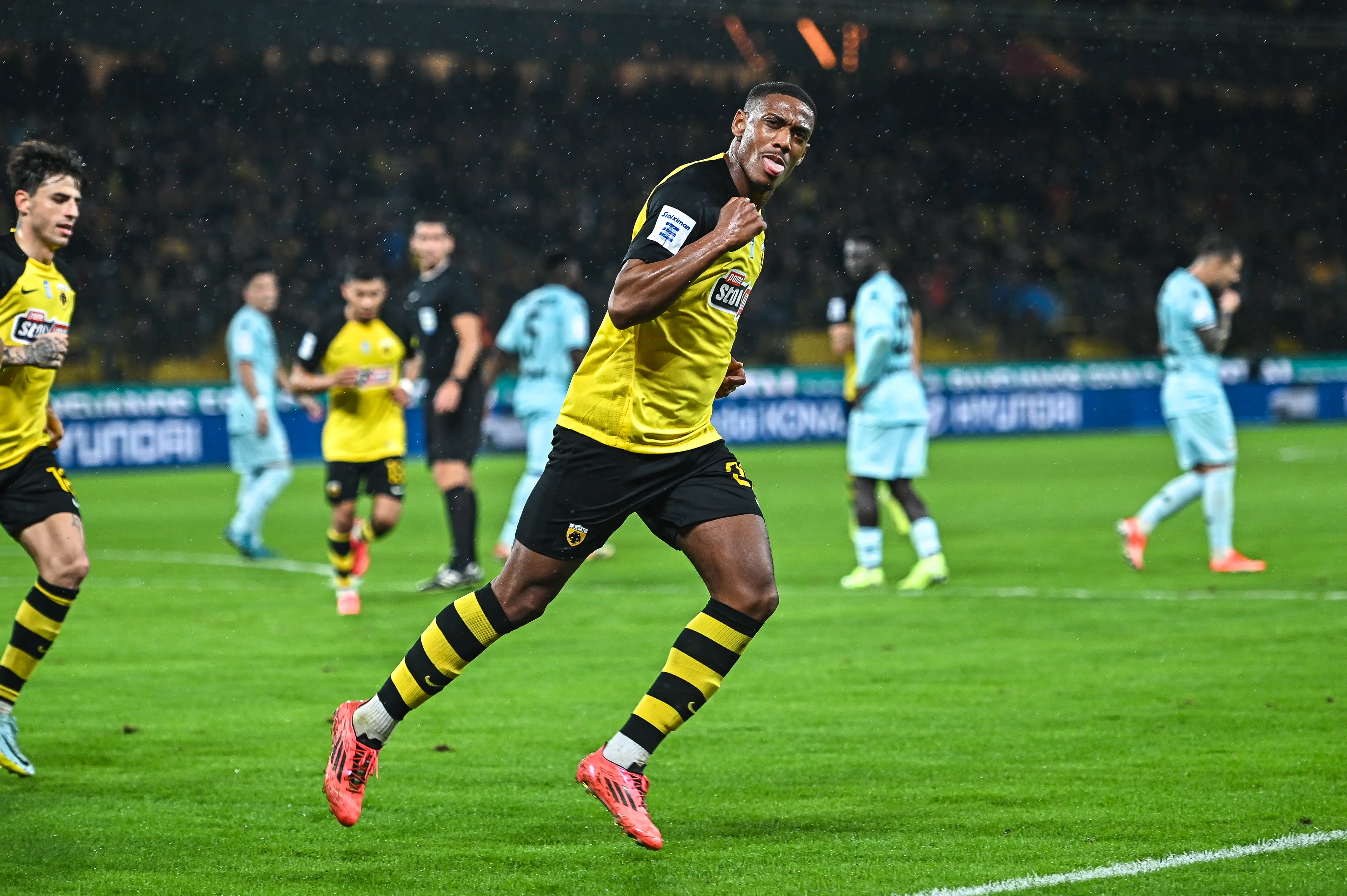 Anthony Martial wheels away in celebration after scoring a goal for AEK Athens. Image: Getty