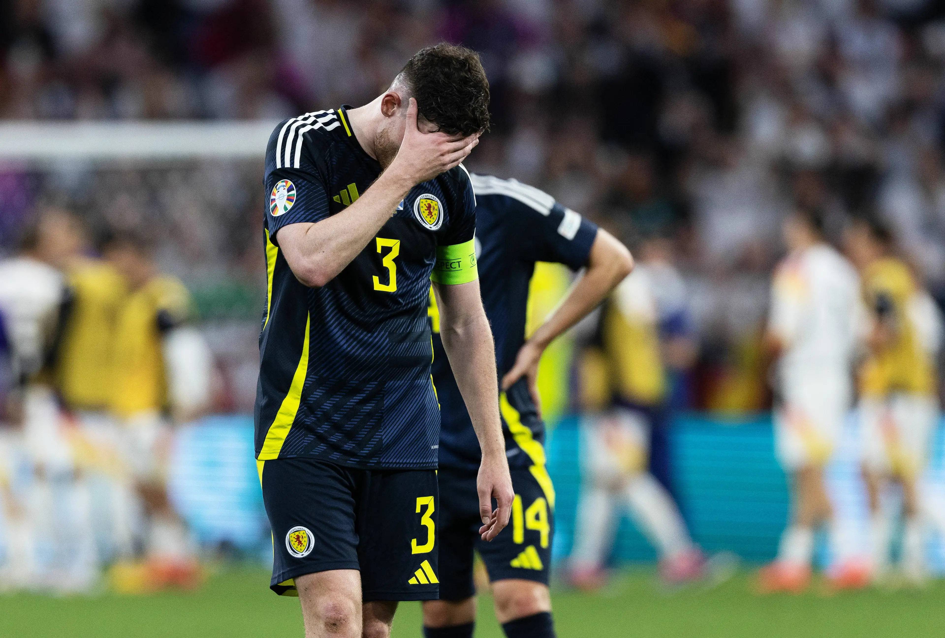 Andy Robertson cuts a dejected figure following Scotland's defeat to Germany. Image: Getty