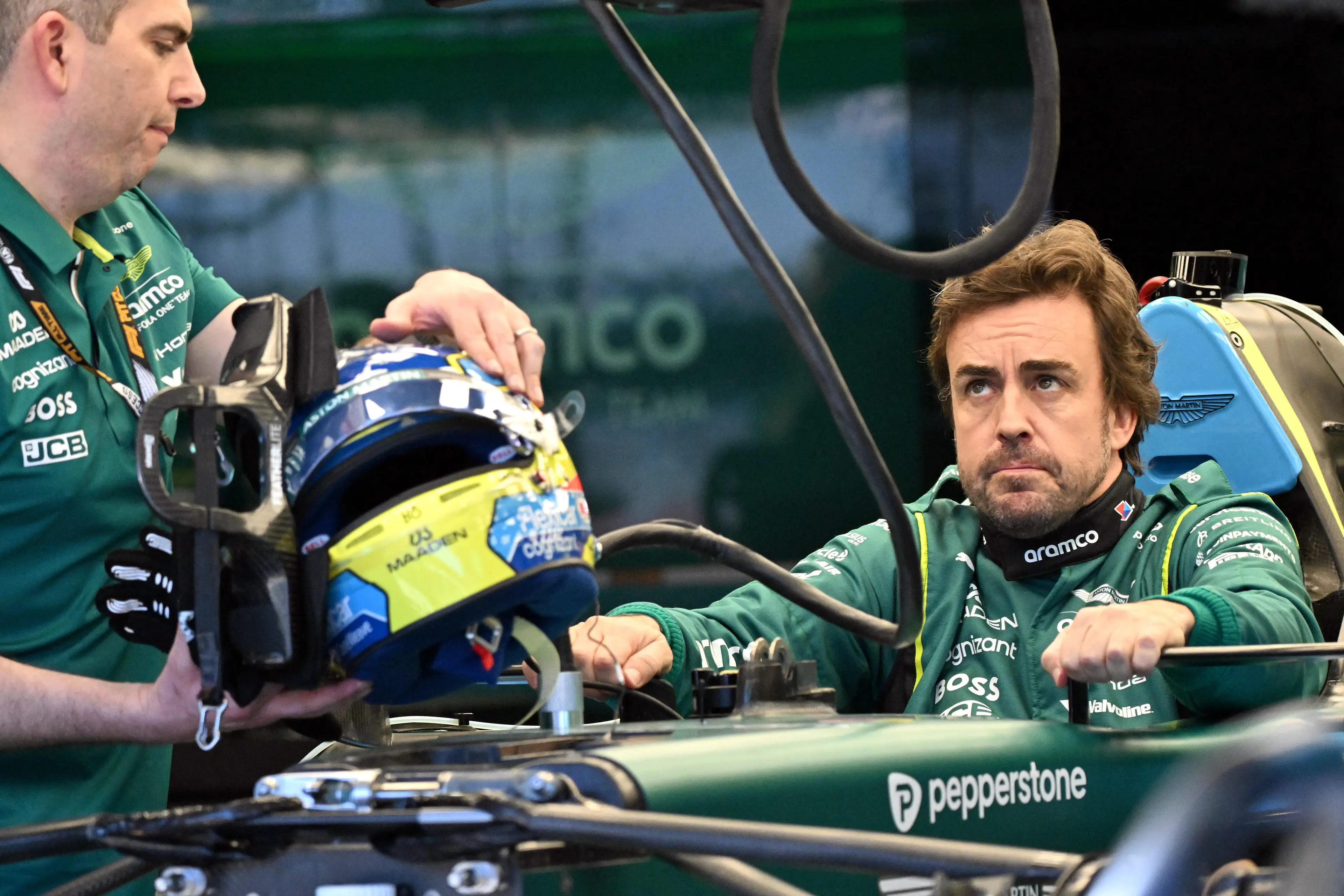 Alonso is reportedly experiencing 'significant discomfort' inside the Aston Martin (Image: Getty)