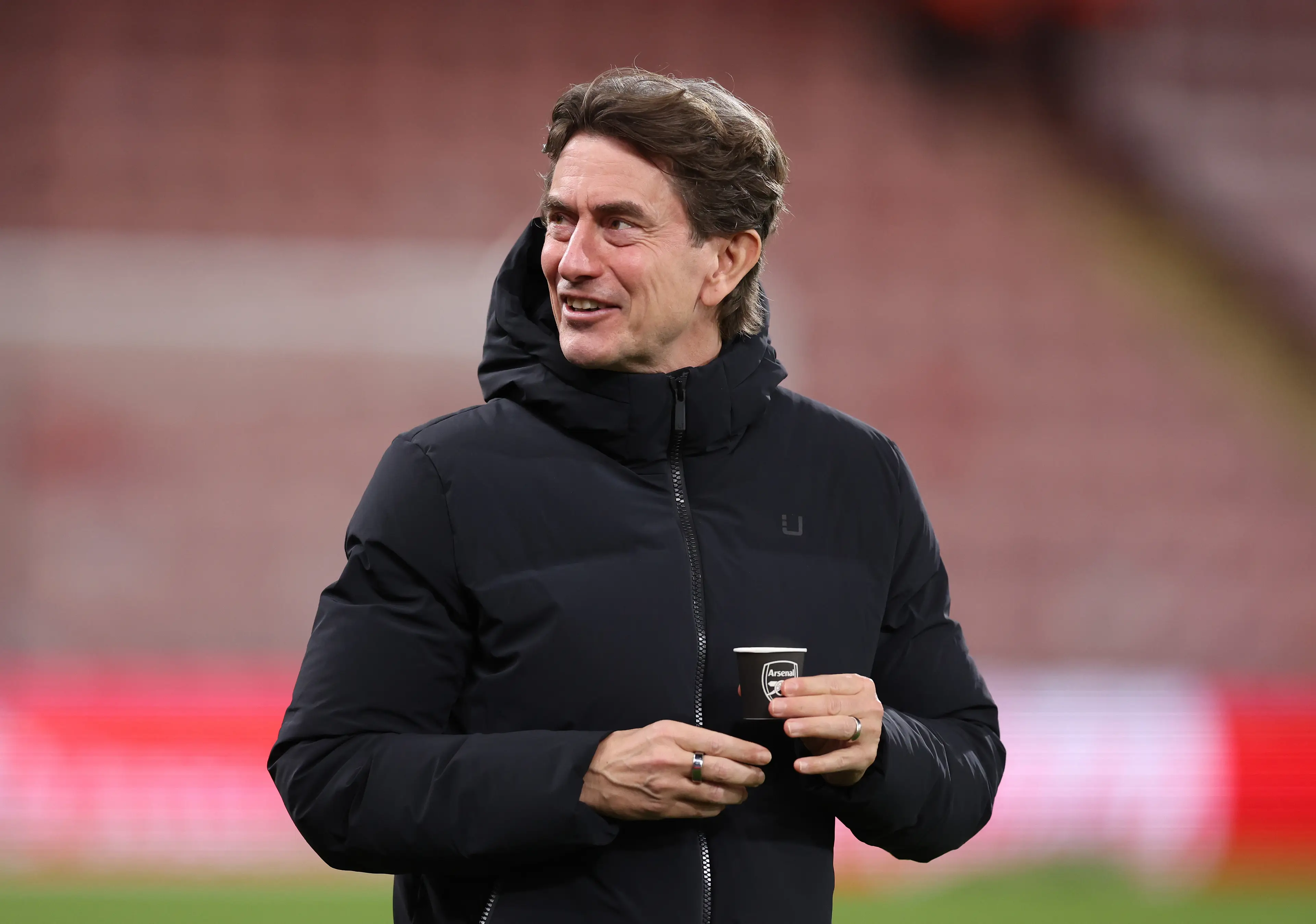 Frank was pictured holding an Arsenal cup before kick-off (Image: Getty)