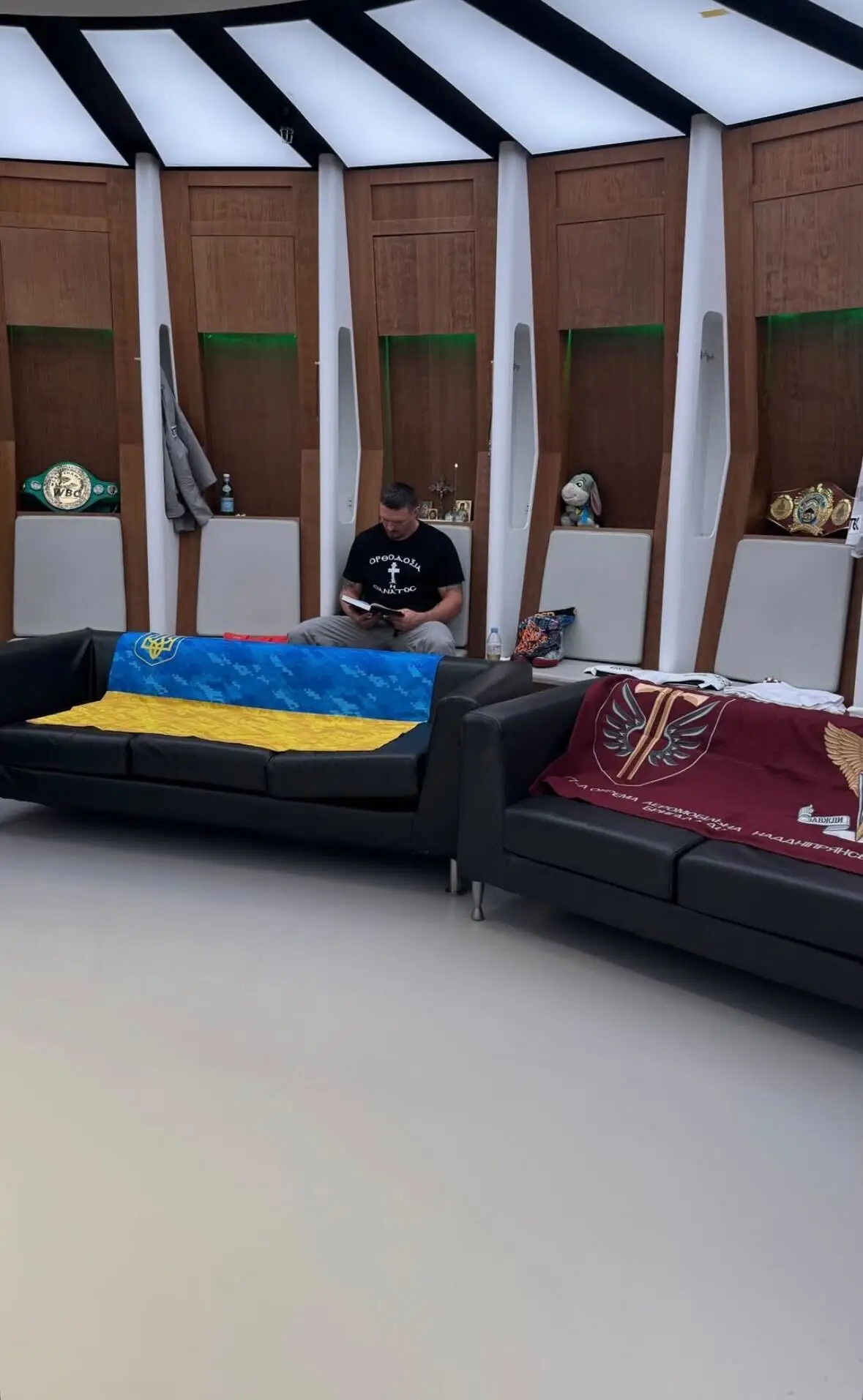Usyk could be seen reading a book ahead of the main event. Image credit: @ringmagazine/X