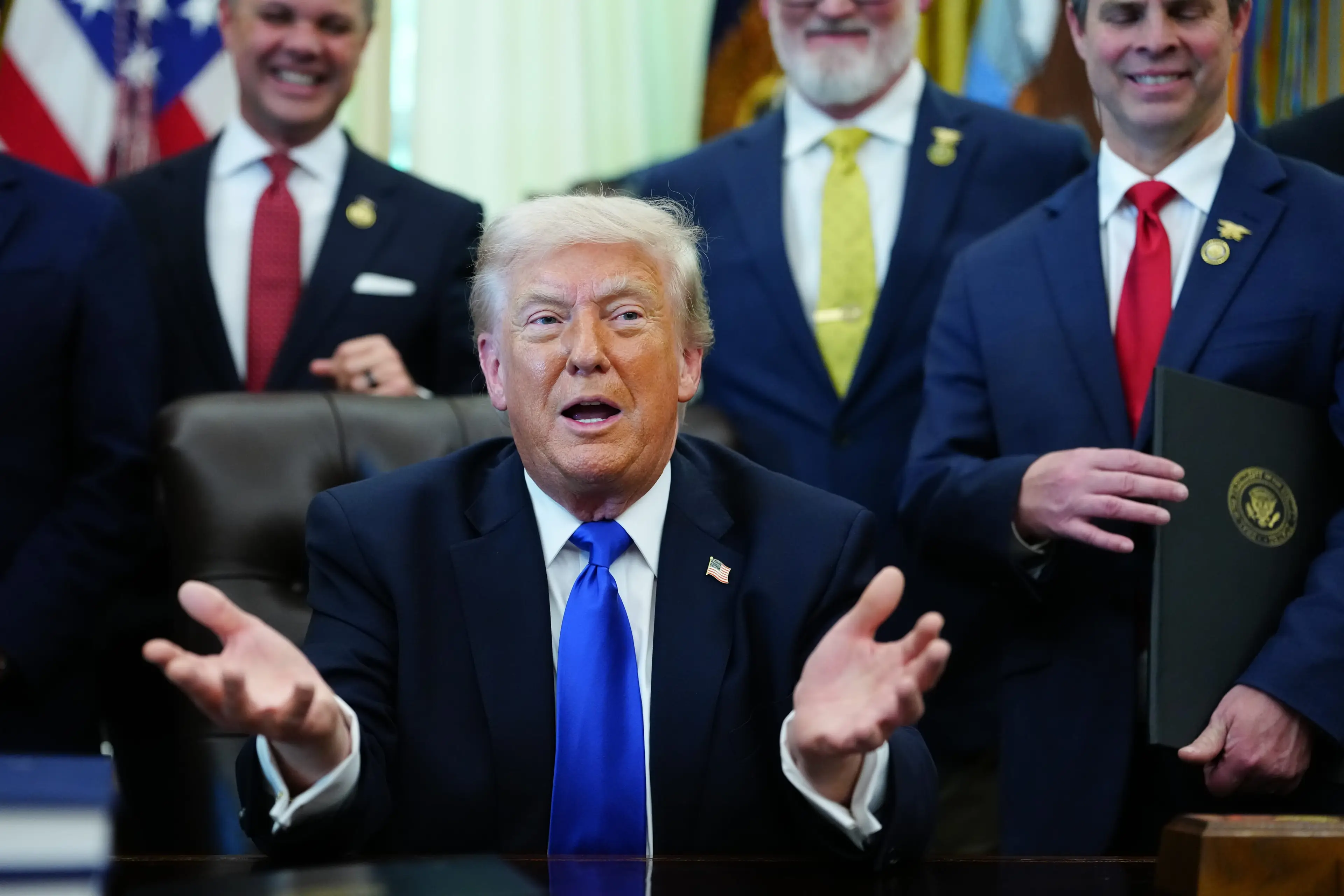 Donald Trump addressed Iran's participation at the World Cup after signing a new executive order (Image: Getty)