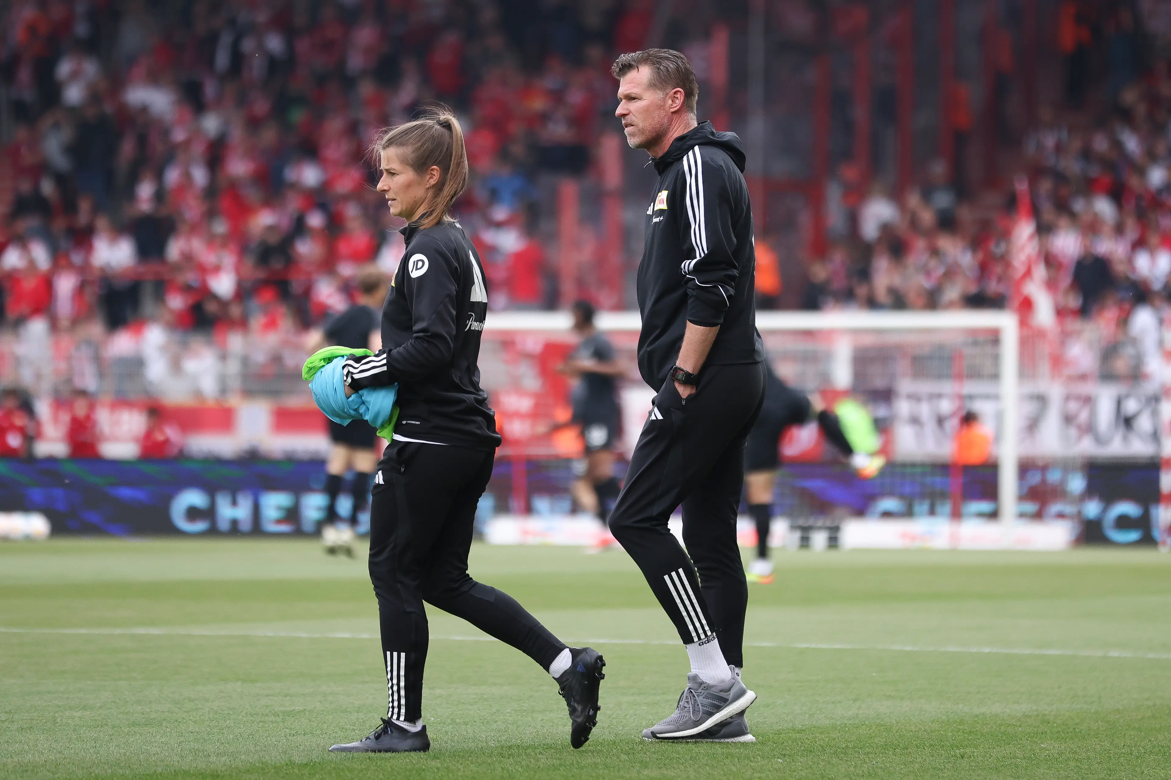 Marco Grote, Interim Head Coach and Marie-Louise Eta of 1.FC Union Berlin, look on prior to the Bundesliga match (Getty Image)