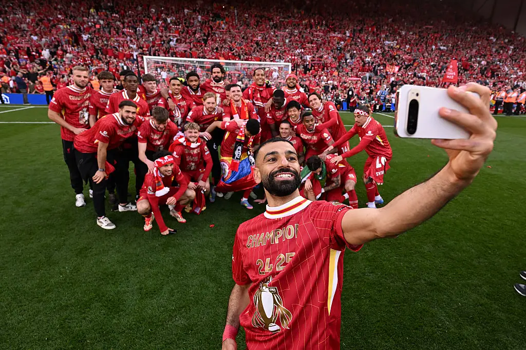 Mohamed Salah enjoyed celebrating with his teammates as Liverpool won the 2024/25 Premier League title. (Image: Getty)