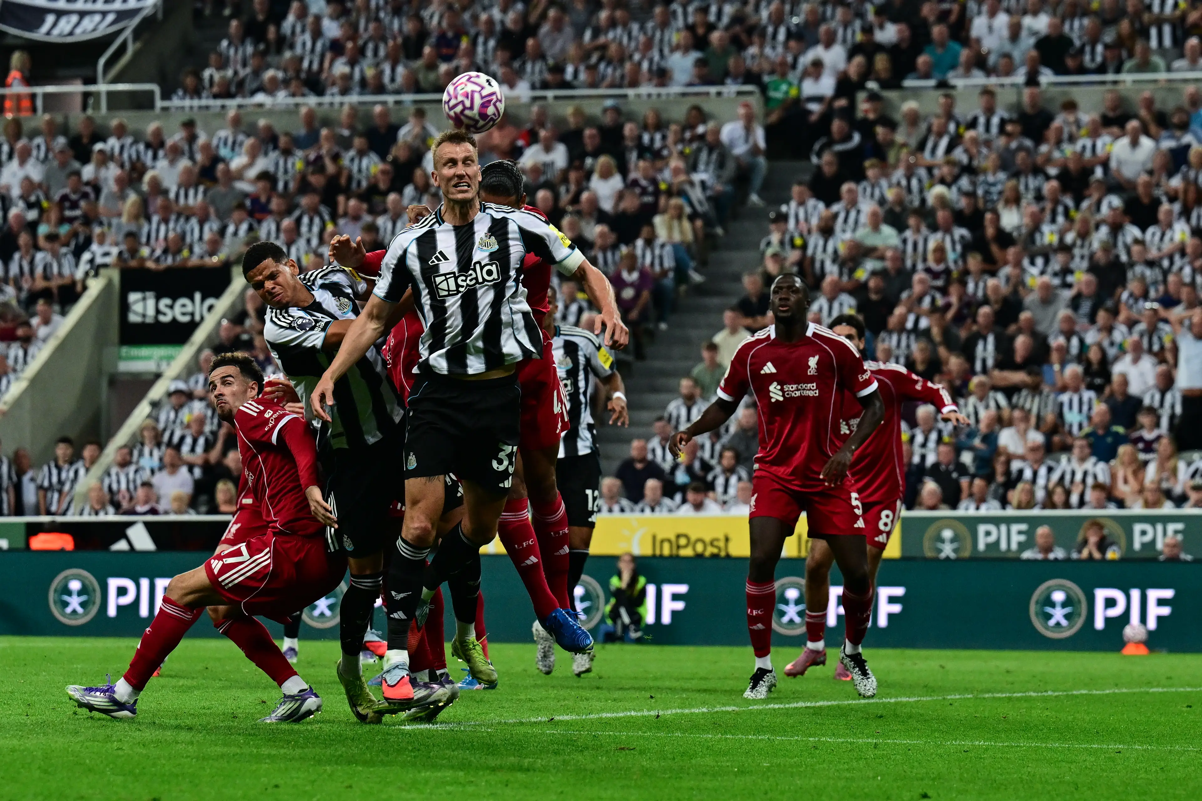 Dan Burn heads the ball during a set-piece in Newcastle United's game against Liverpool. Image: Getty