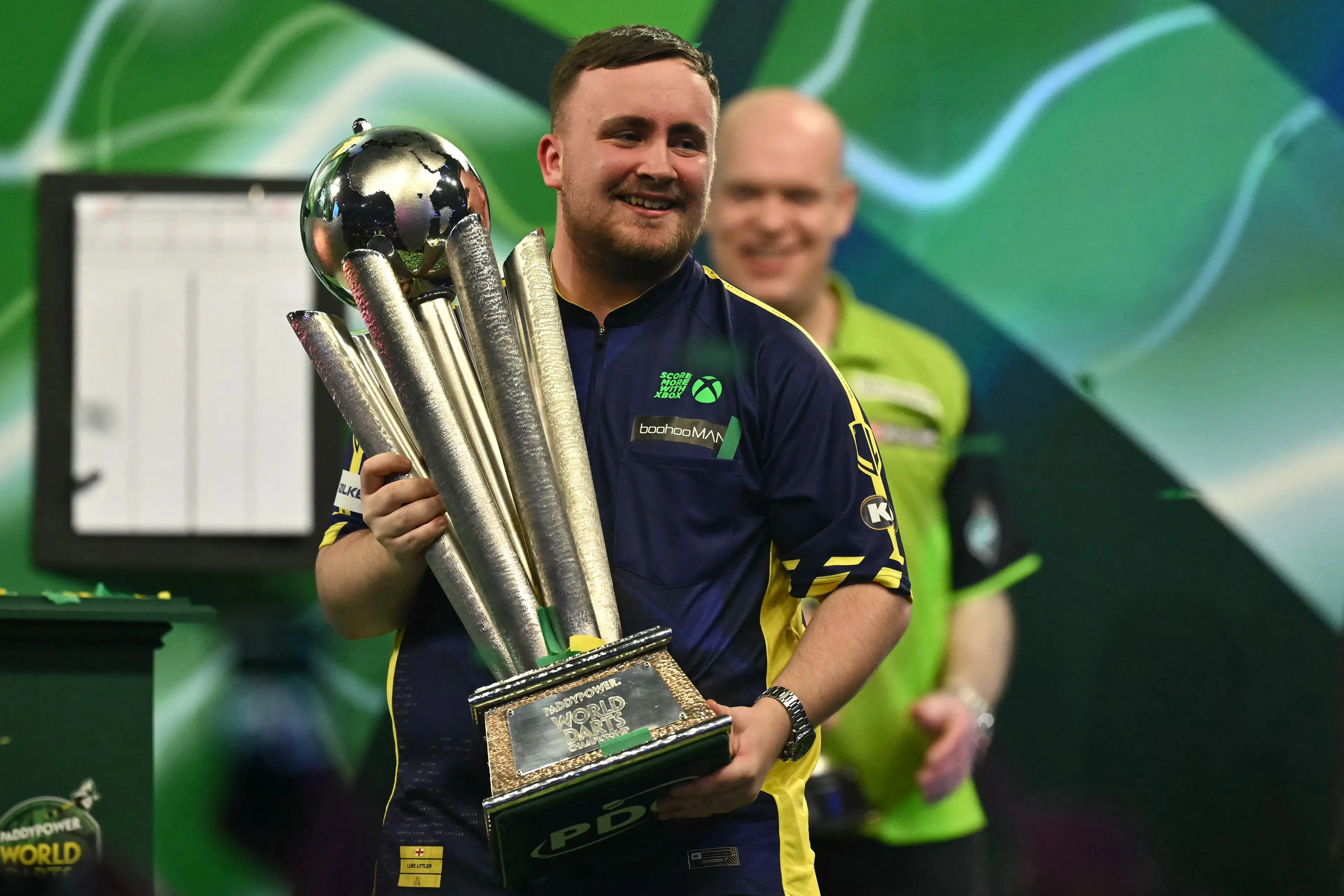 Littler lifts the World Championship title. Image credit: Getty 