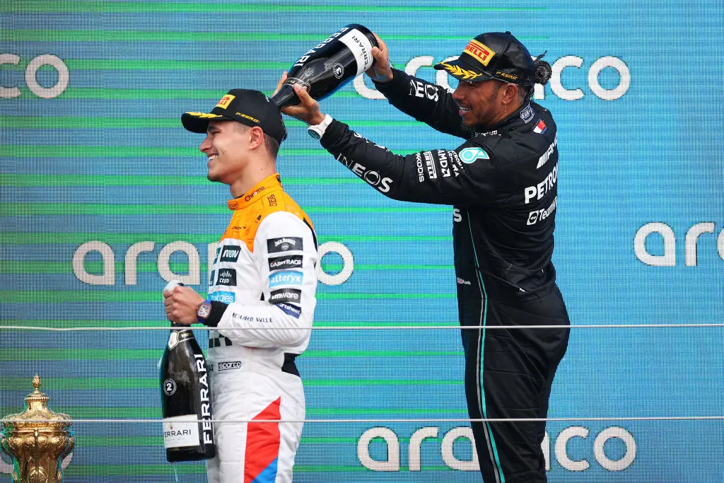 Lewis Hamilton and Lando Norris celebrating on the Silverstone podium in 2023- Getty