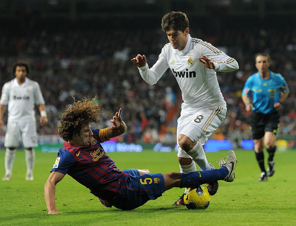 Carles Puyol tackles Kaka in 2009 (Credit:Getty)