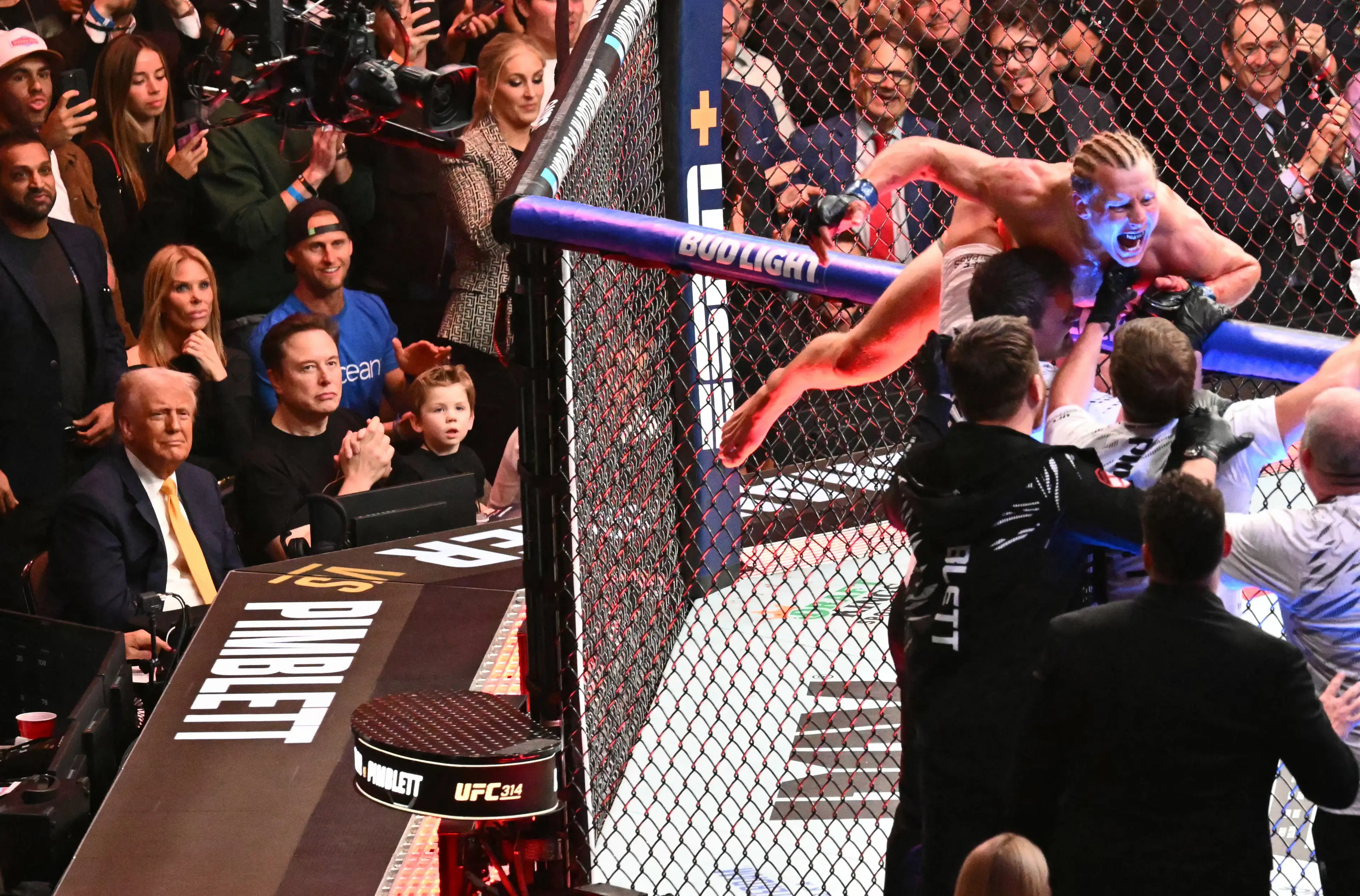 Donald Trump watches on as Paddy Pimblett celebrates his victory over Michael Chandler at UFC 314. Image: Getty