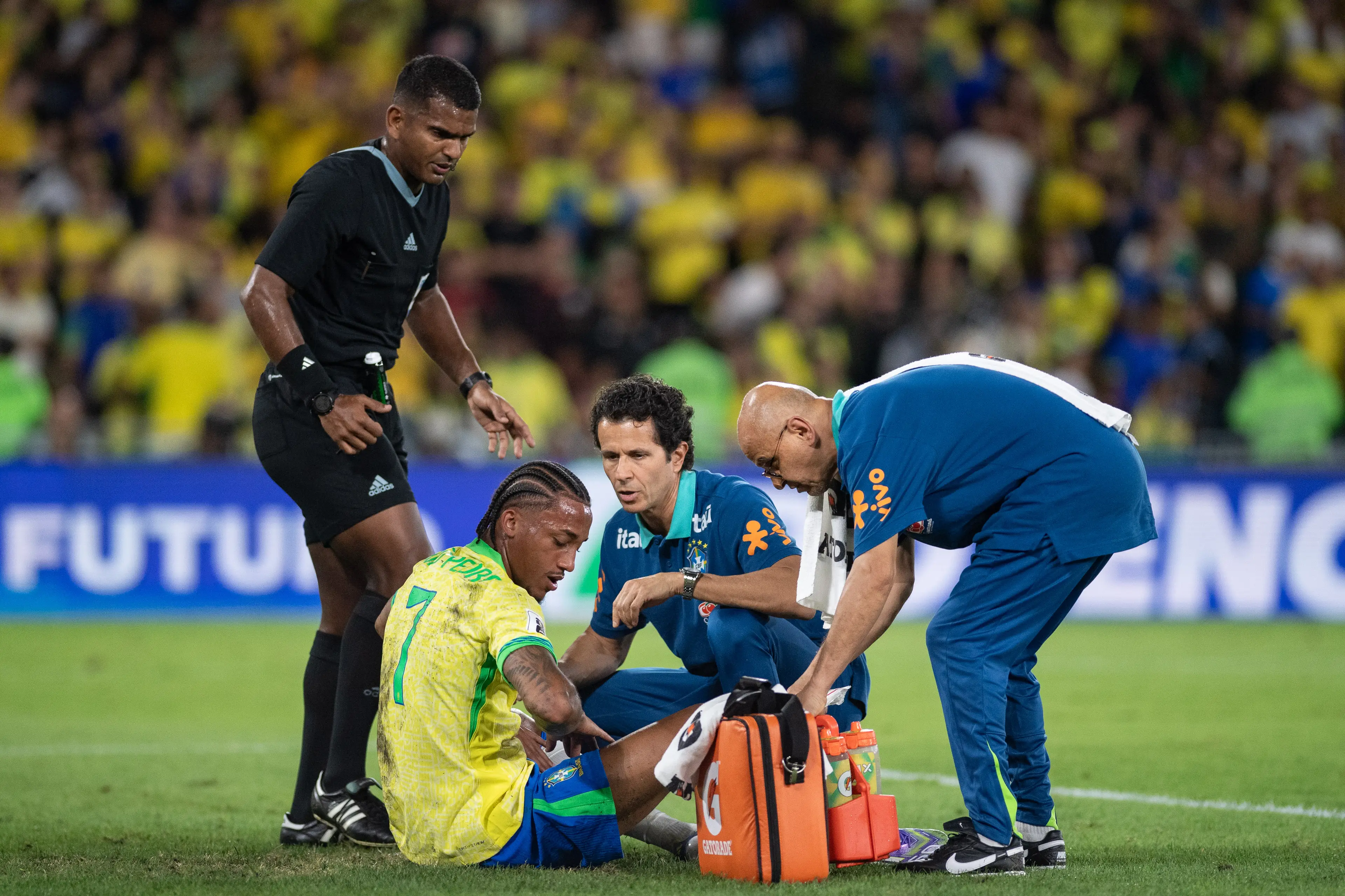 Joao Pedro receives treatment after colliding with Gabriel Martinelli. Image: Getty 