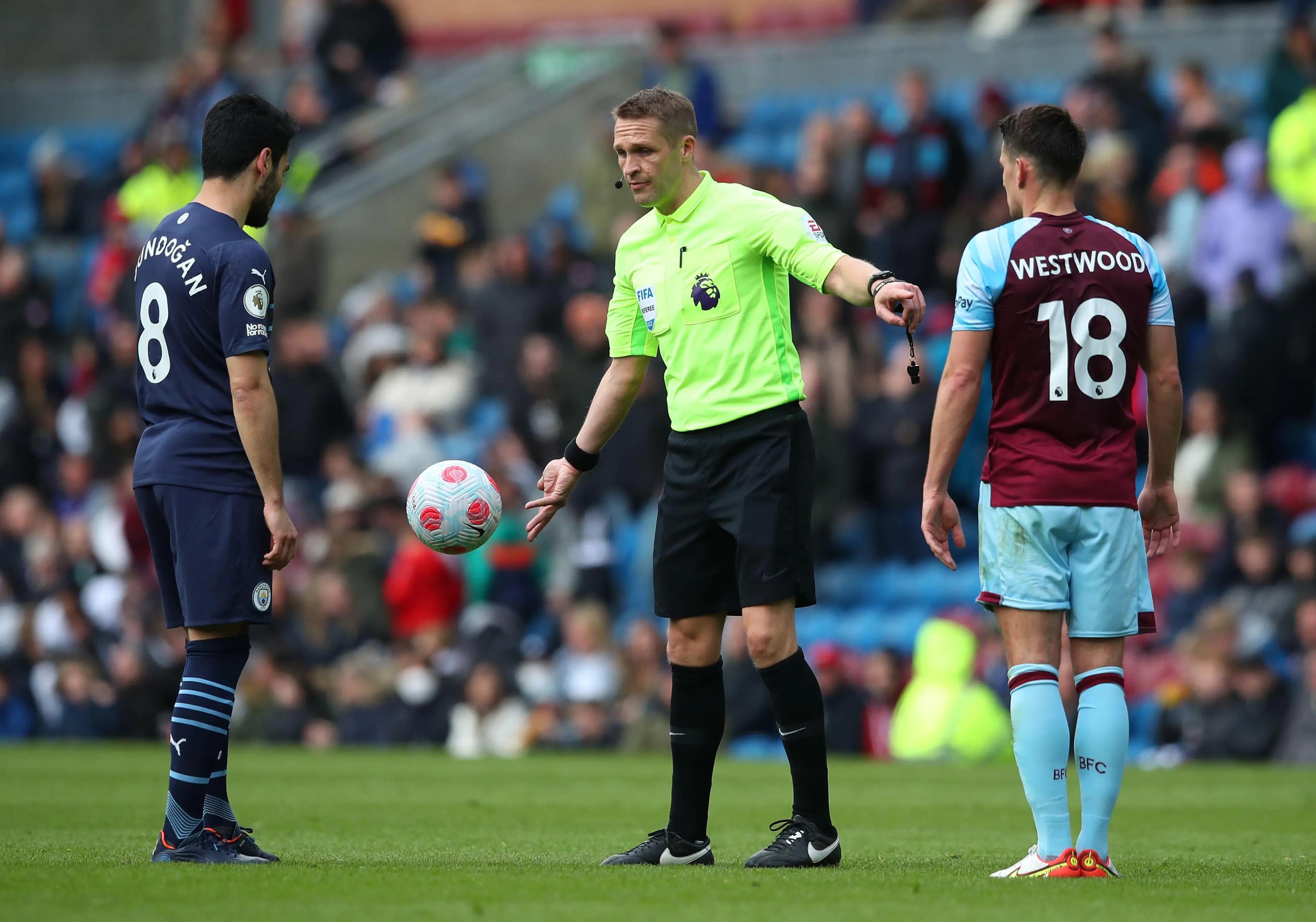 Craig Pawson signals a free-kick to Manchester City's Ilkay Gundogan. Sportimage / Alamy
