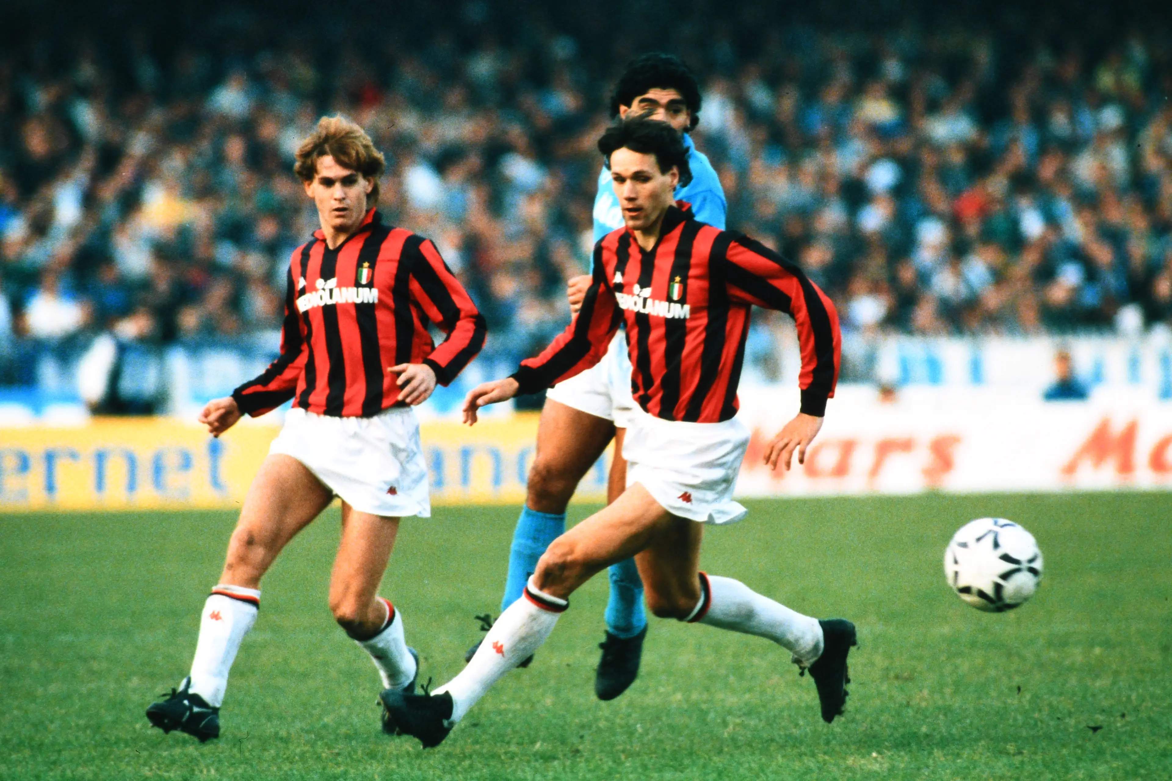 Diego Maradona and Marco van Basten playing against each other in Italy. Image: Getty 
