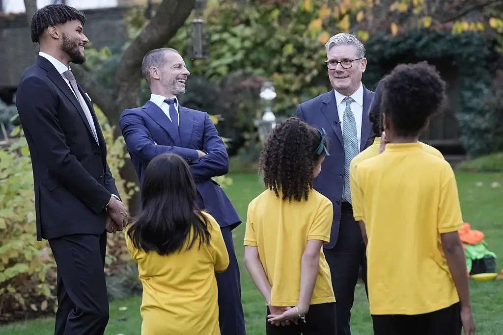 Keir Starmer alongside Tyrone Mings and Aleksander Ceferin at the Euro 2028 launch (Image: Getty)