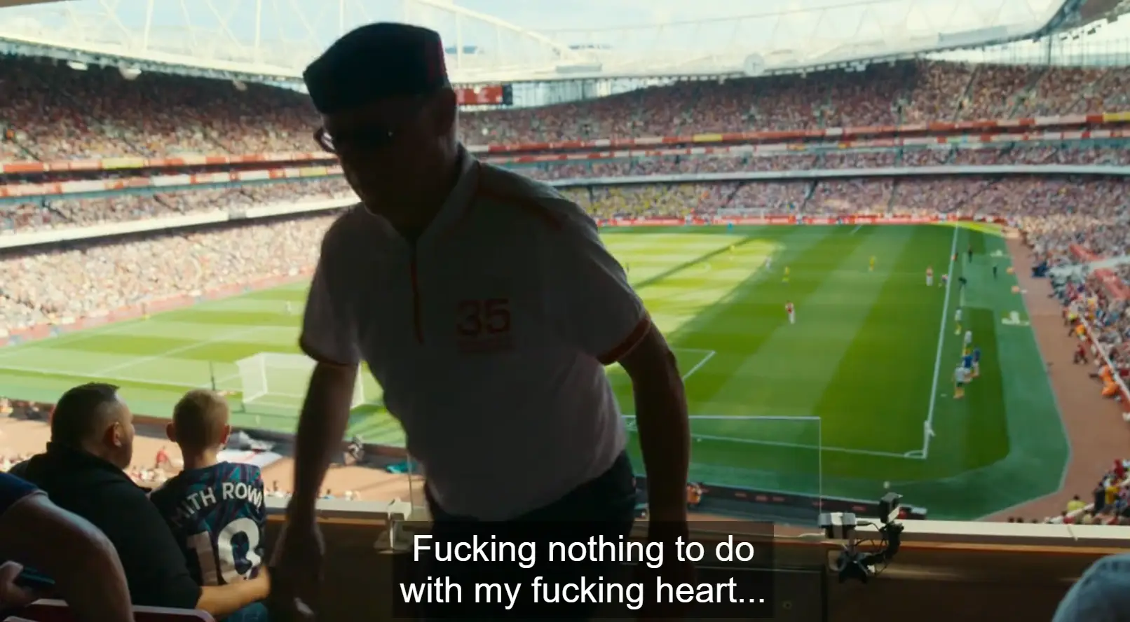 Aaron Ramsdale's dad turns away, with the pressure of the game getting to him.