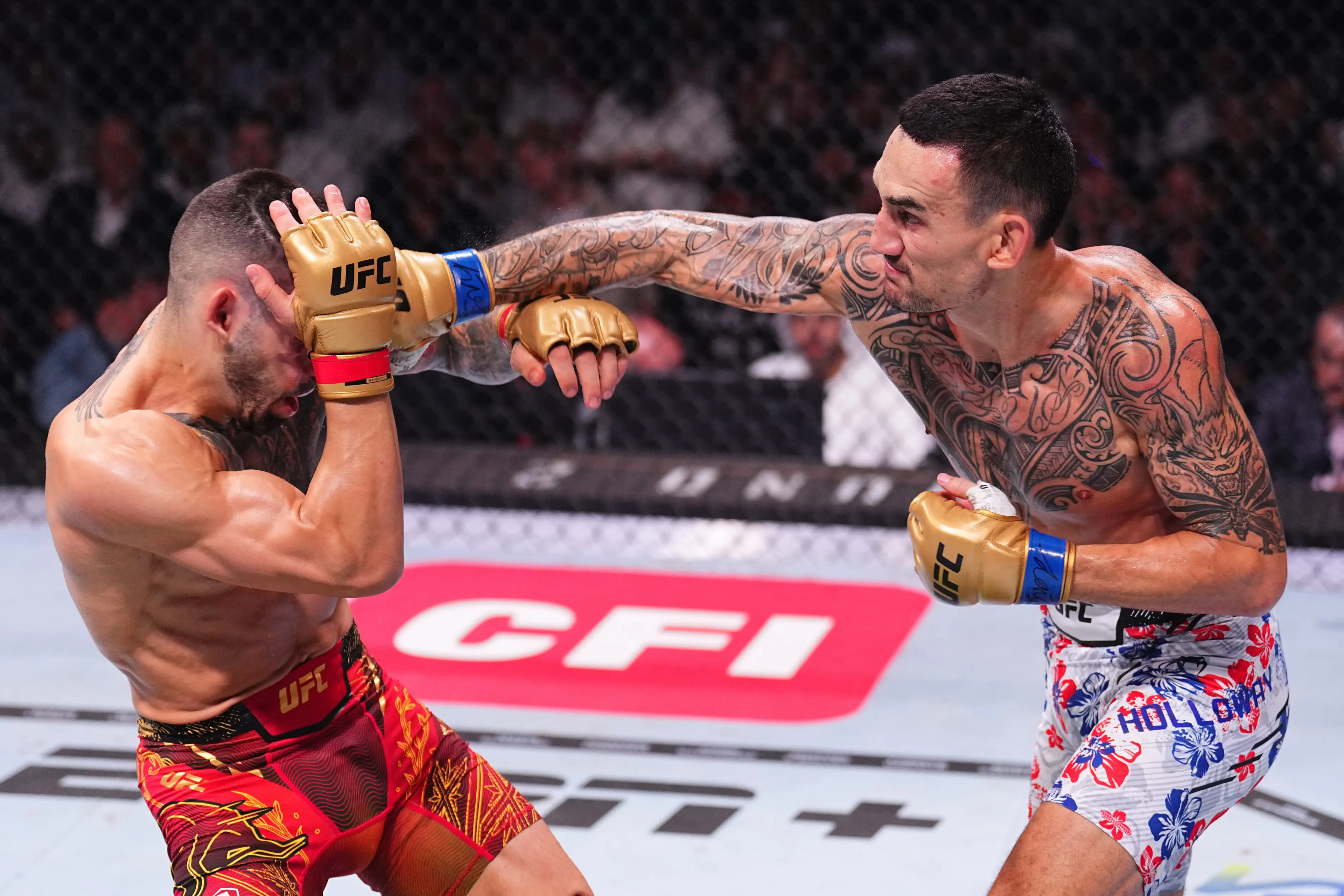 Ilia Topuria and Max Holloway wearing the new UFC gloves during their UFC 308 championship clash. Image: Getty