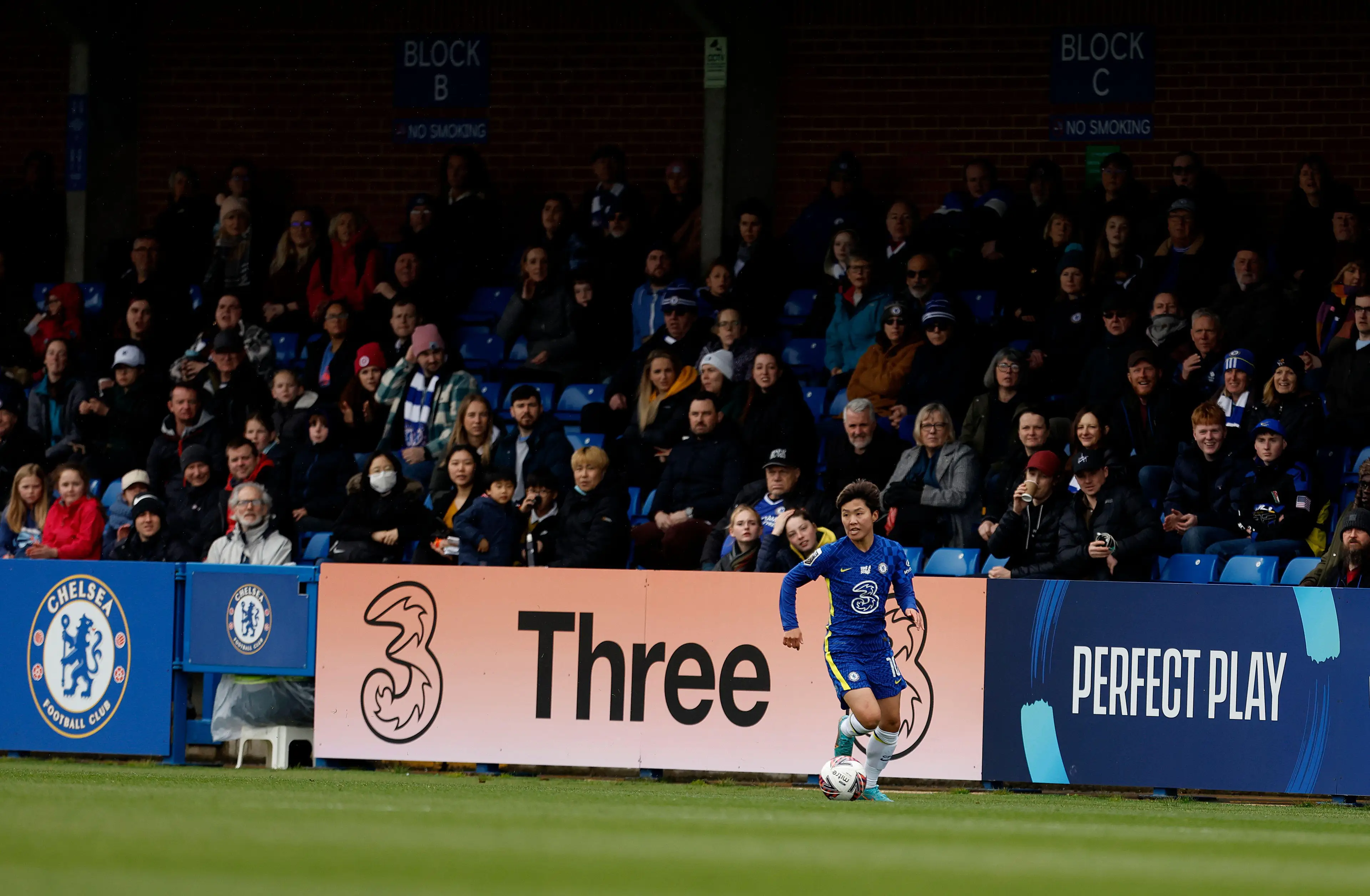 Chelsea Women's Ji So-Yum running past a sponsor board for 'Three' during the Barclays FA Women's Super League match at Kingsmeadow. (Alamy)