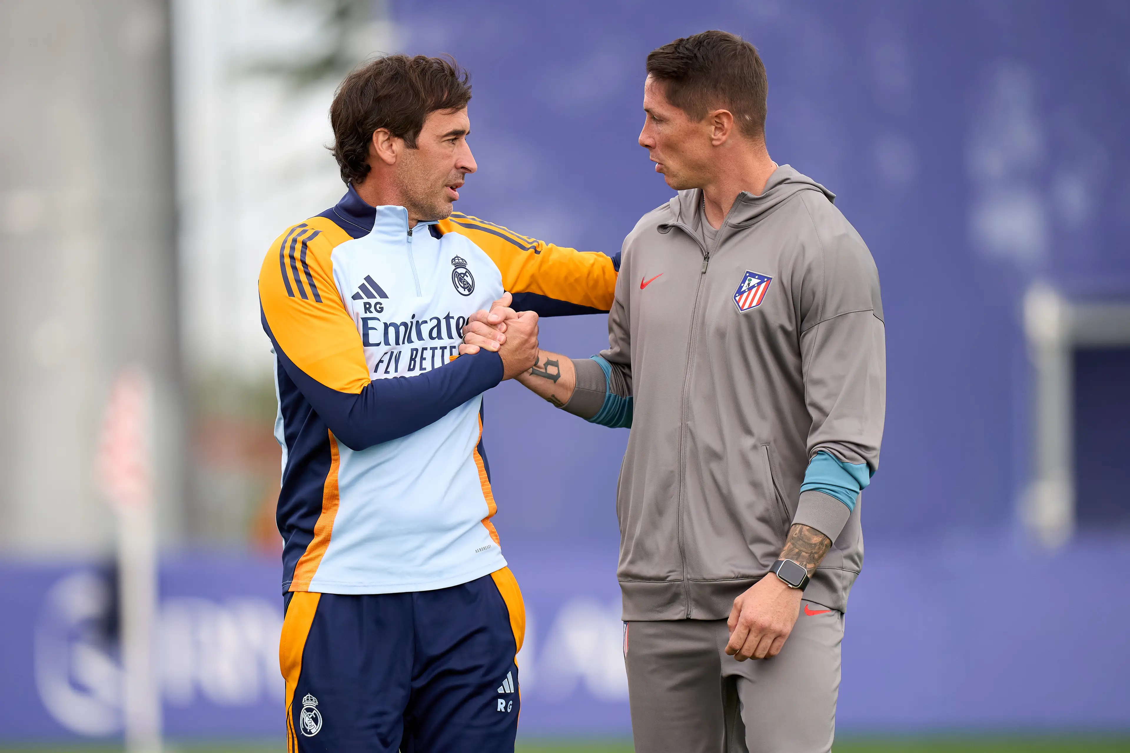 Raul interacts with Fernando Torres ahead of a youth game between Real Madrid and Atletico. Image credit: Getty