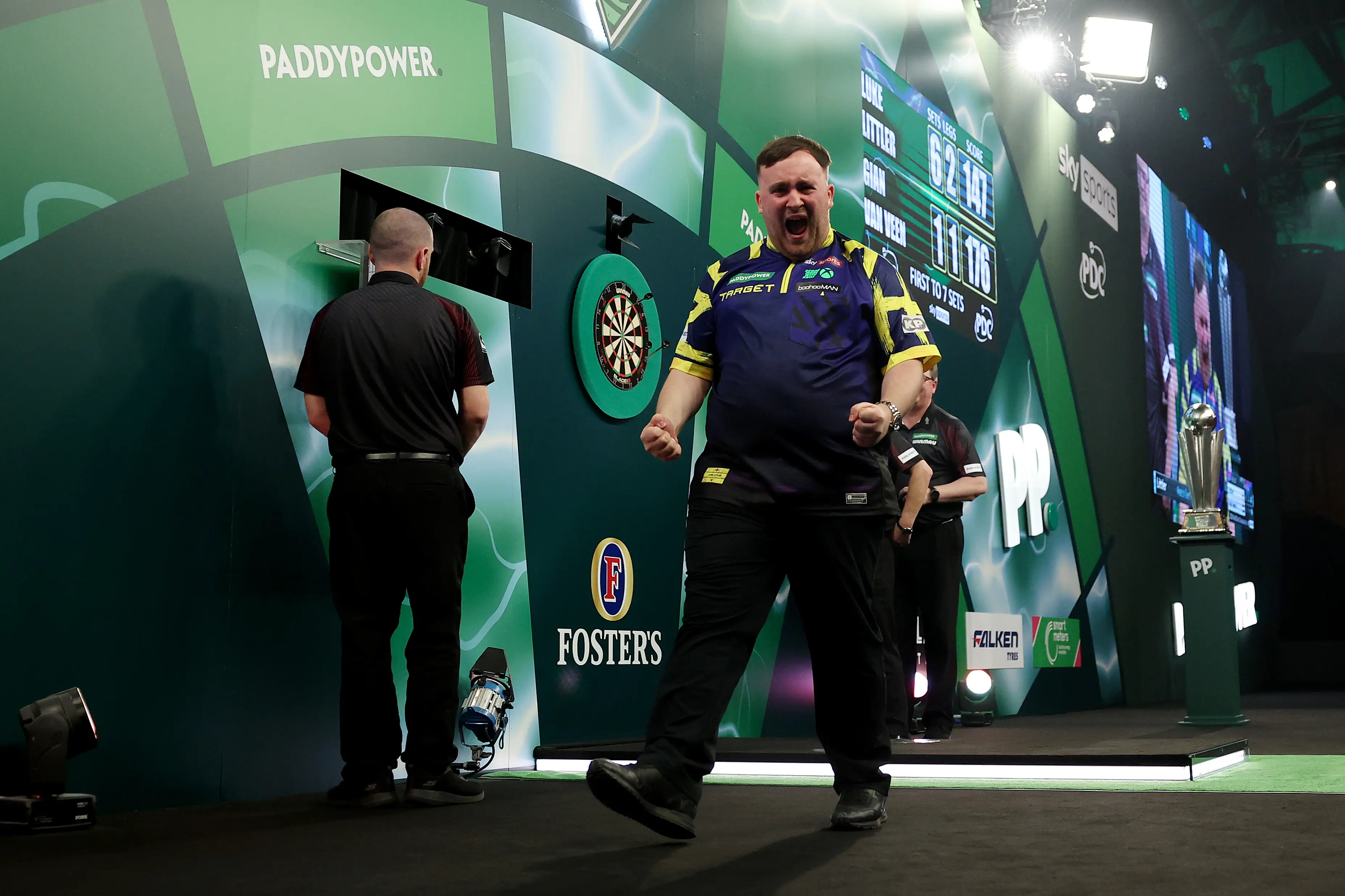Luke Littler celebrates winning the World Darts Championship. Image: Getty 