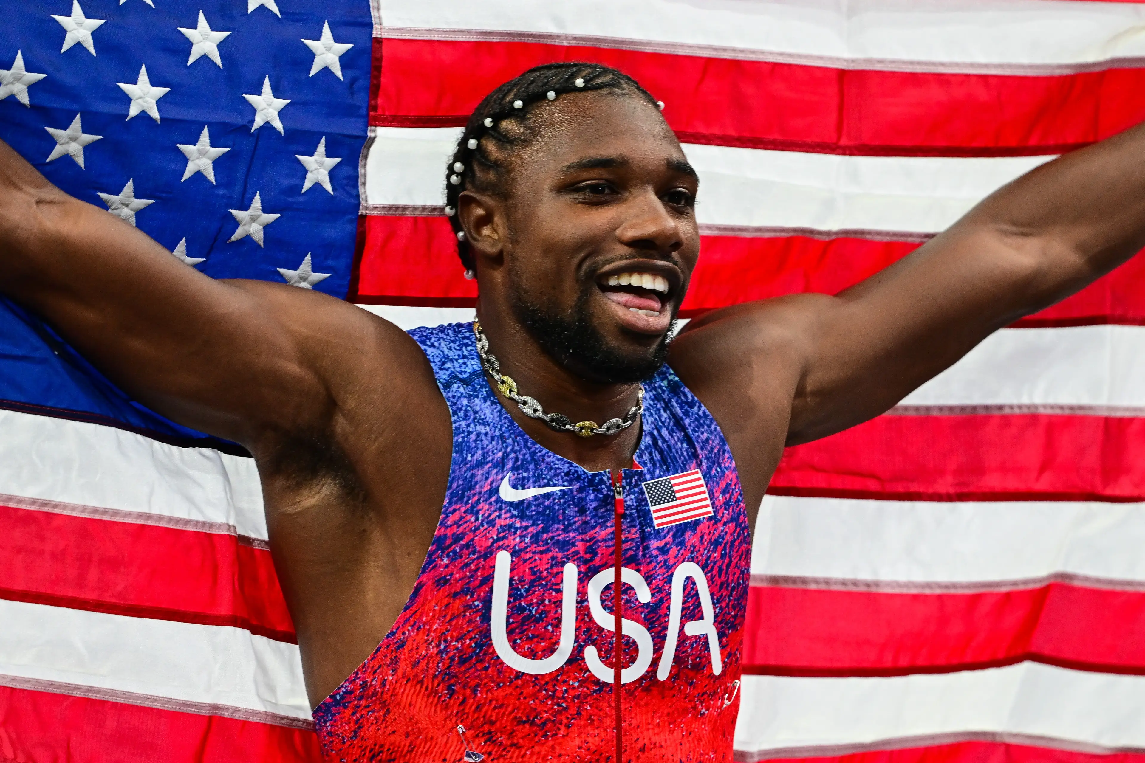 Noah Lyles celebrates after winning the men's 100m in Paris. Image: Getty