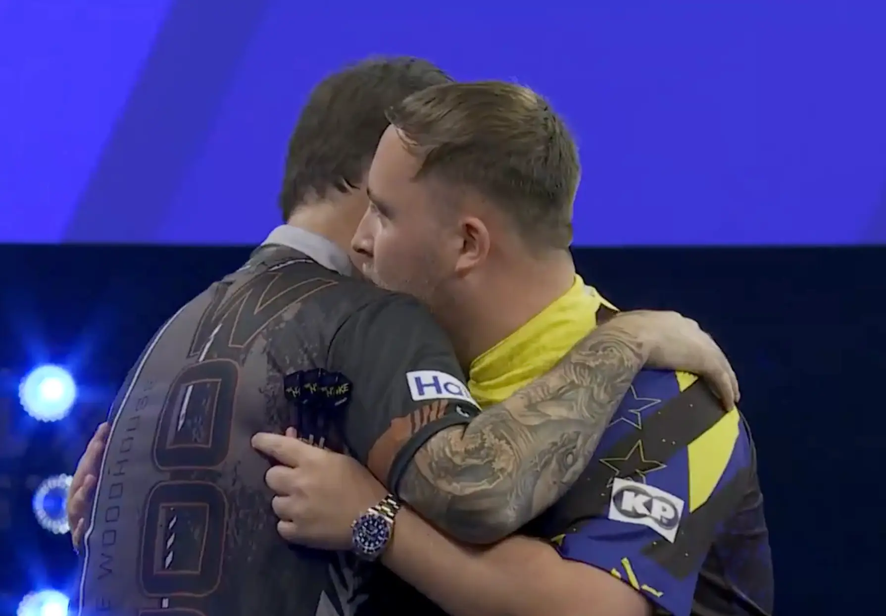 Littler congratulates Woodhouse on his victory. Image credit: Sky Sports