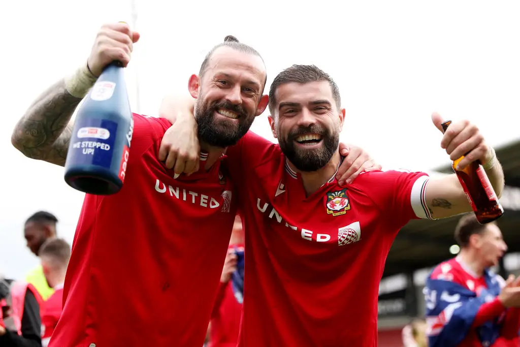 Steven Fletcher celebrates promotion from League Two with Wrexham team-mate Elliot Lee (Image: Getty)