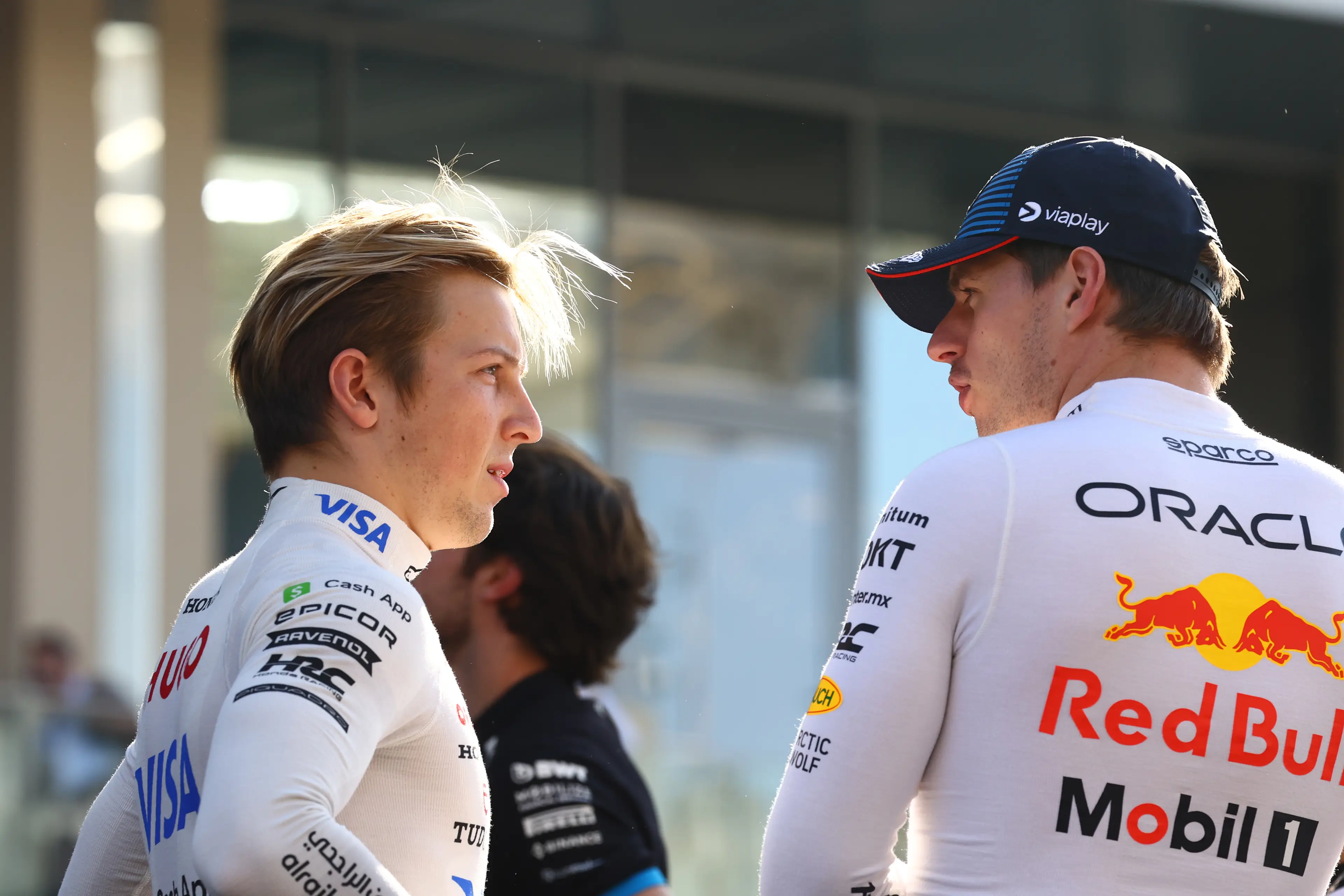 Liam Lawson of Visa Cash App RB talks to Max Verstappen prior to Abu Dhabi GP. Image credit: Getty