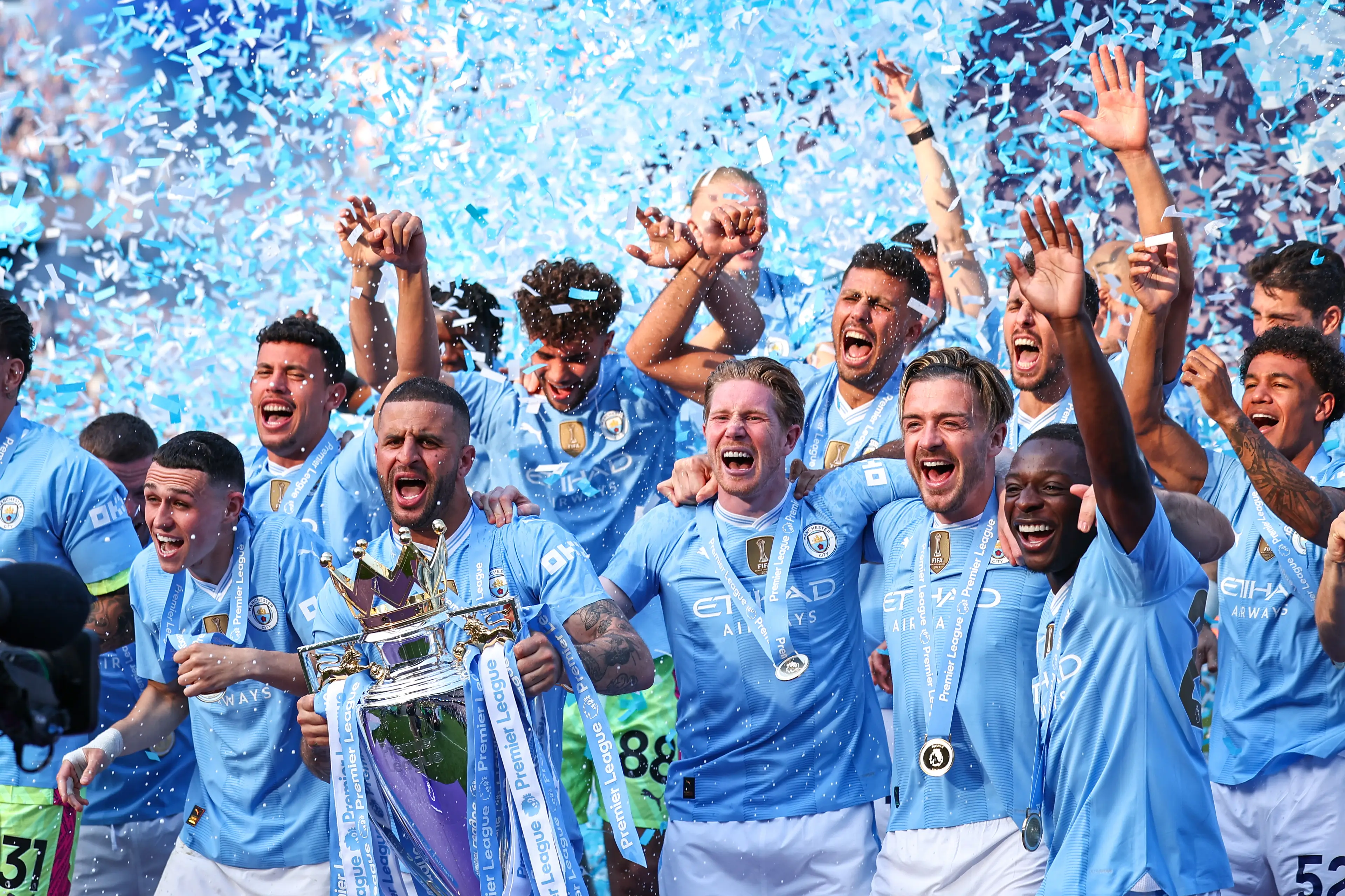 Manchester City players celebrate winning the Premier League title. Image: Getty